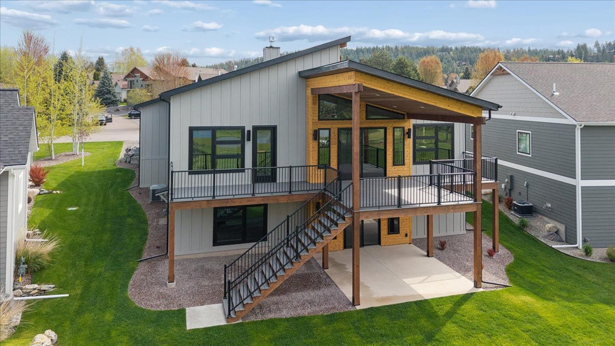 116 Golden Bear Drive, Bigfork, MT 59911 Covered composite deck and lower level patio makes it easy to enjoy the outdoors.