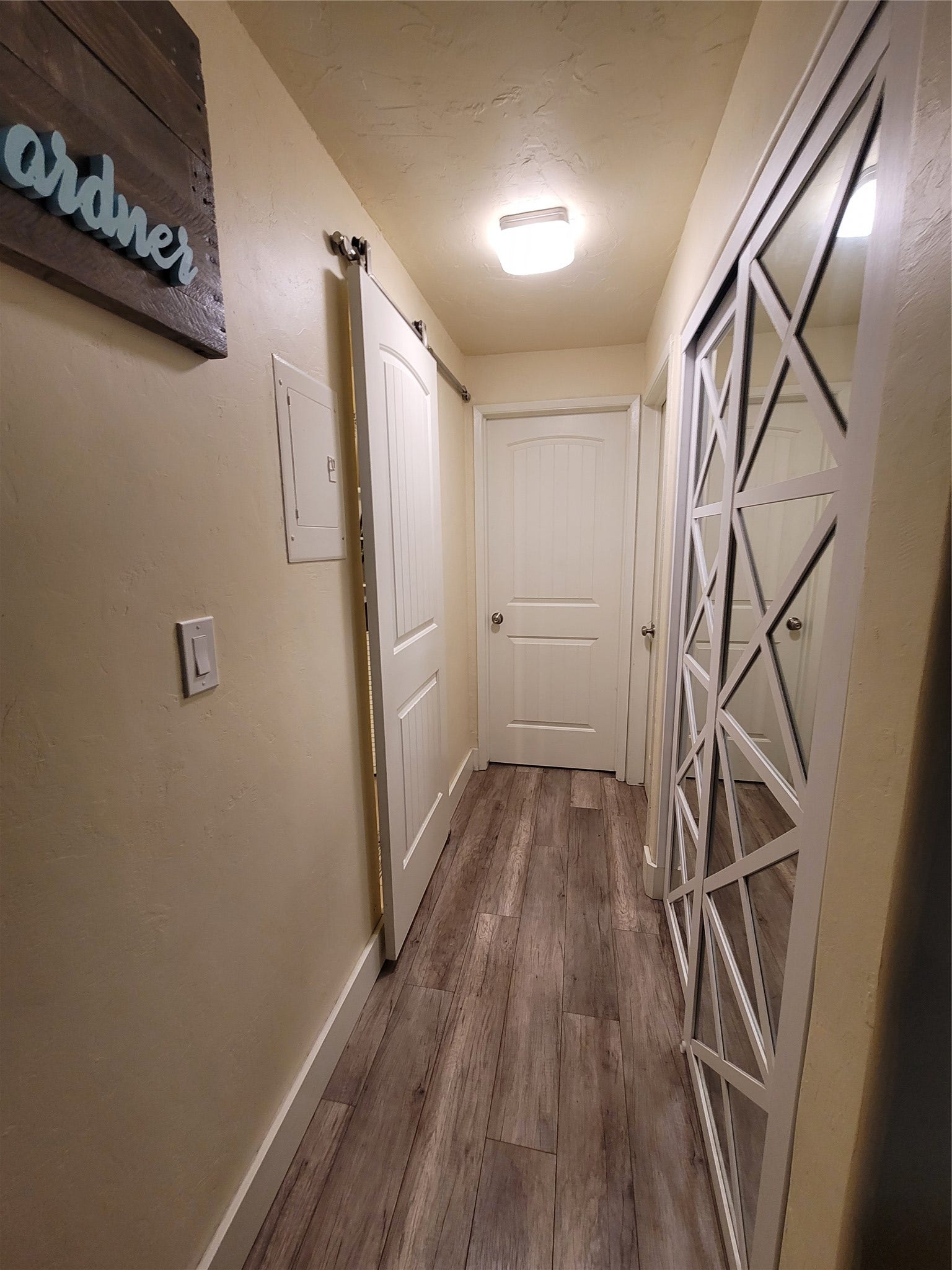 8575 Mt Hwy 35, #11, Bigfork, MT 59911 Hallway to bathroom (left) bedroom 2 and bedroom 1. storage closet with water heater (right)