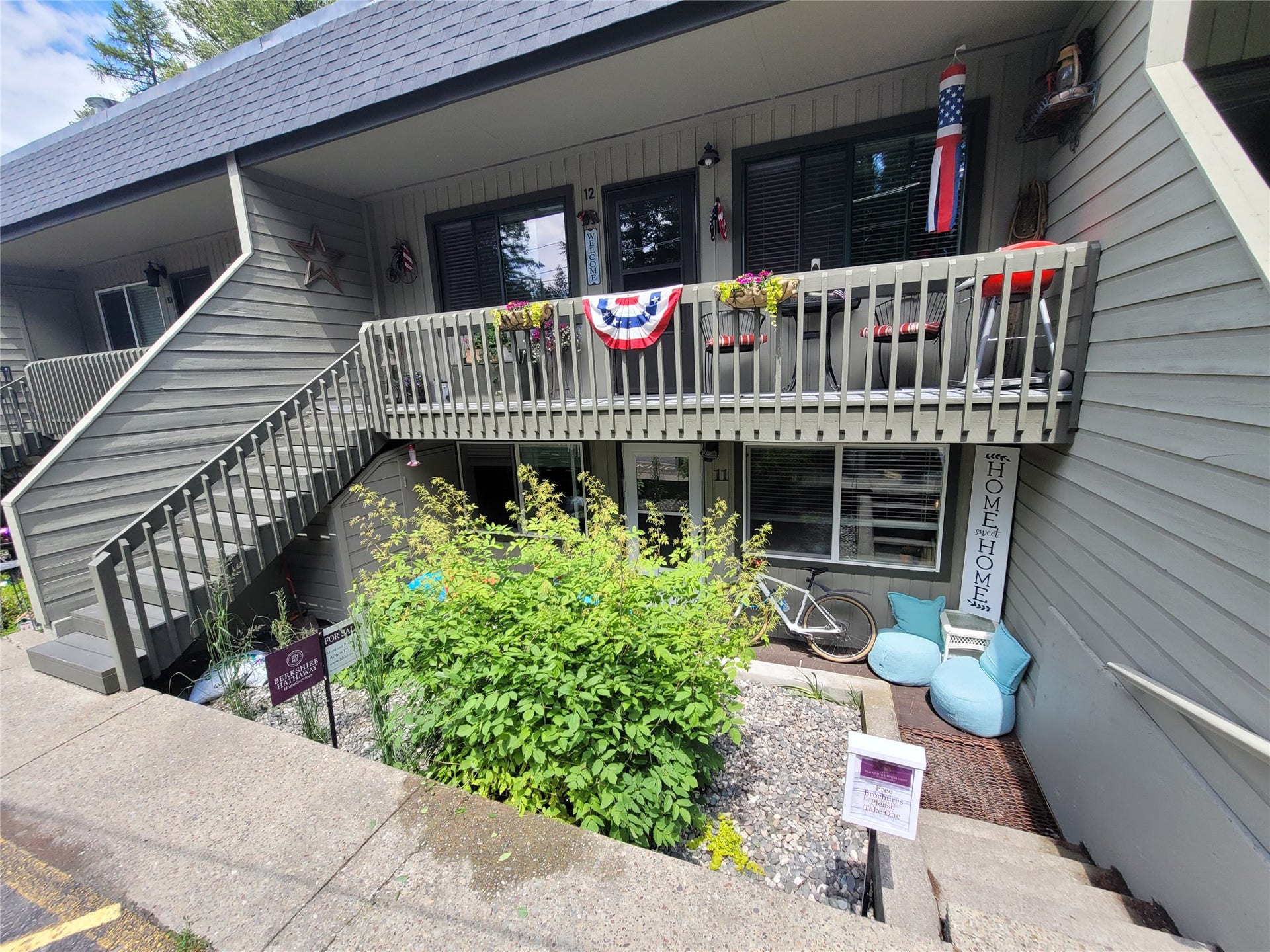 8575 Mt Hwy 35, #11, Bigfork, MT 59911 Front of Condo, Garden area, storage closet under stairs to the left.