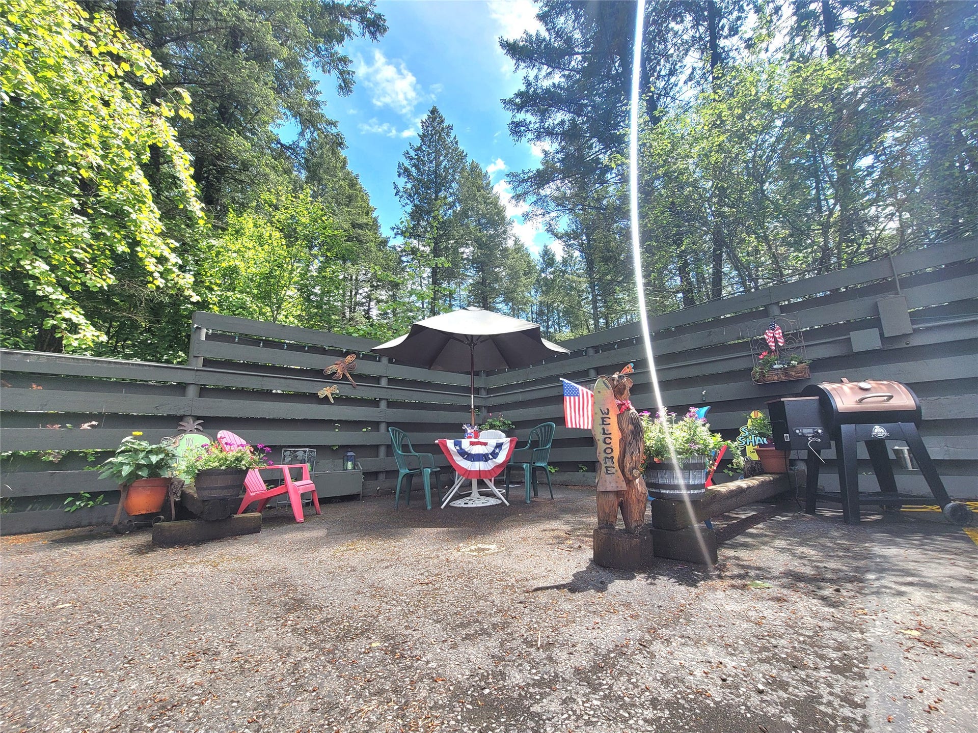 8575 Mt Hwy 35, #11, Bigfork, MT 59911 Community area where the HOA puts up a pavilion to socialize and hangout. parking spot for condo is to the right with plugs for BBQS.
