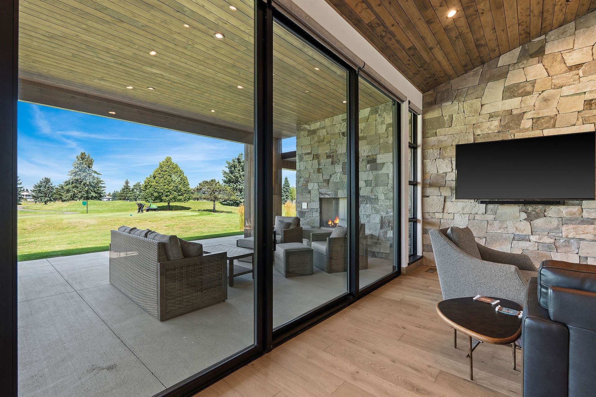 1283 Lake Pointe Drive, Bigfork, MT 59911 Large sliding glass doors to covered patio overlooking golf course