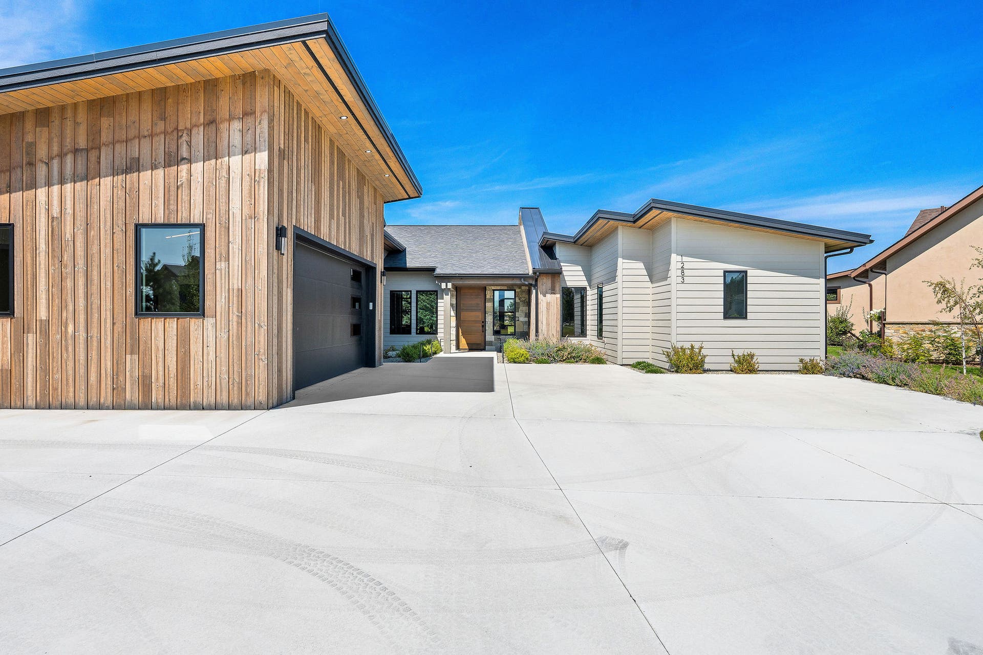 1283 Lake Pointe Drive, Bigfork, MT 59911 Beautiful vertical wood siding, step-free living throughout the entire home and garage