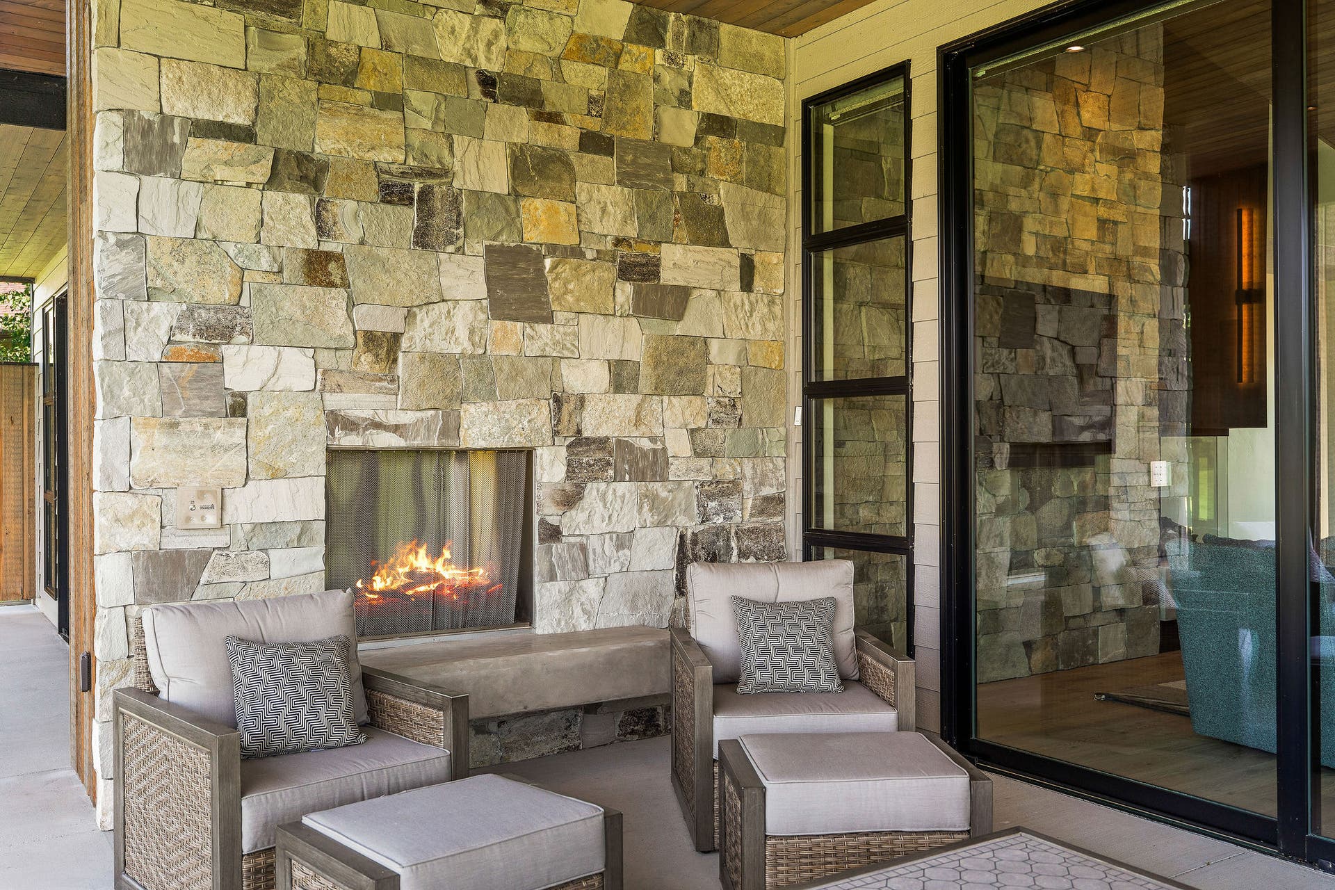 1283 Lake Pointe Drive, Bigfork, MT 59911 Outdoor natural gas fireplace with Italian plaster hearth