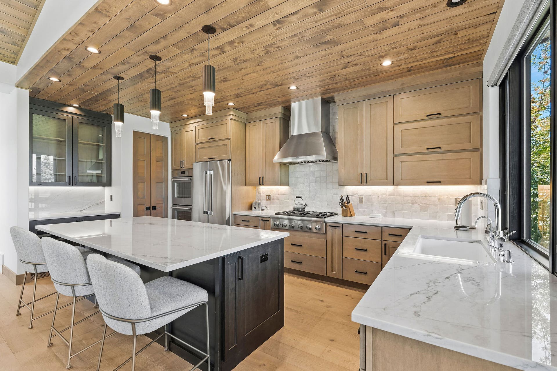 1283 Lake Pointe Drive, Bigfork, MT 59911 Oversized white pearl quartzite island with bar top seating and storage
