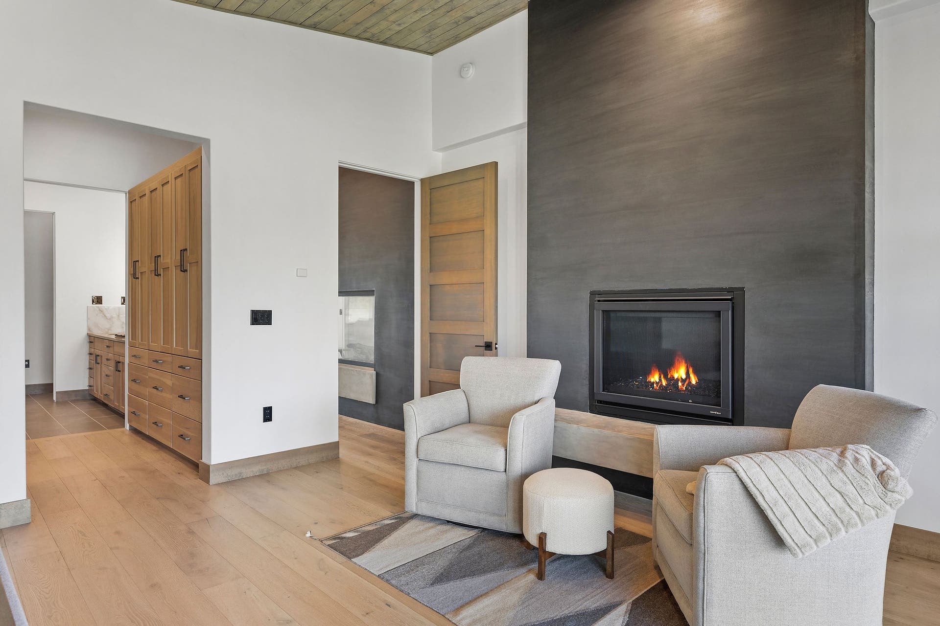 1283 Lake Pointe Drive, Bigfork, MT 59911 Natural gas fireplace with floor to ceiling Italian plaster surround and hearth