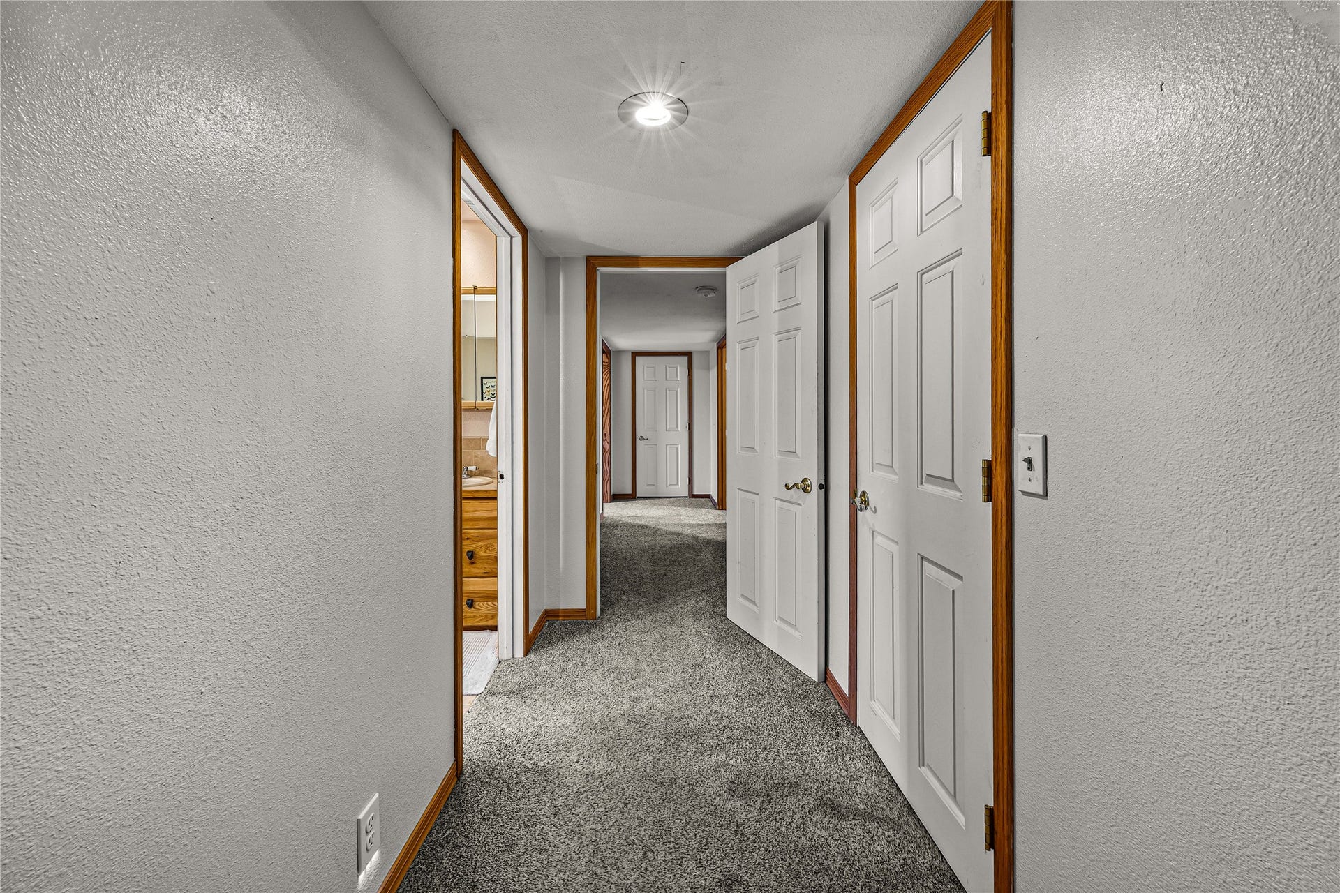 Hallway to basement bedrooms