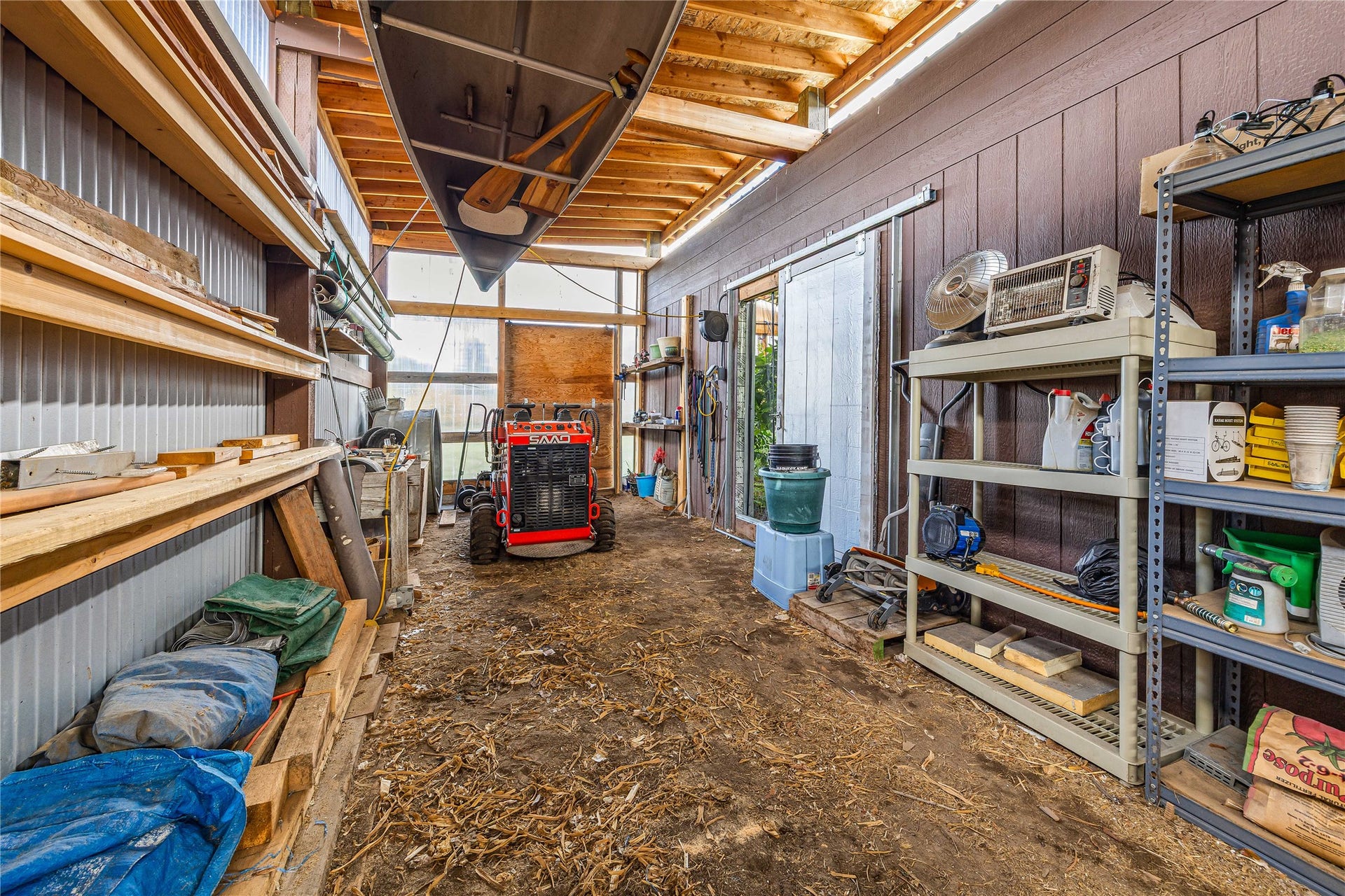 Storage off greenhouse.  Possible RV parking (Door has been replaced by wall).