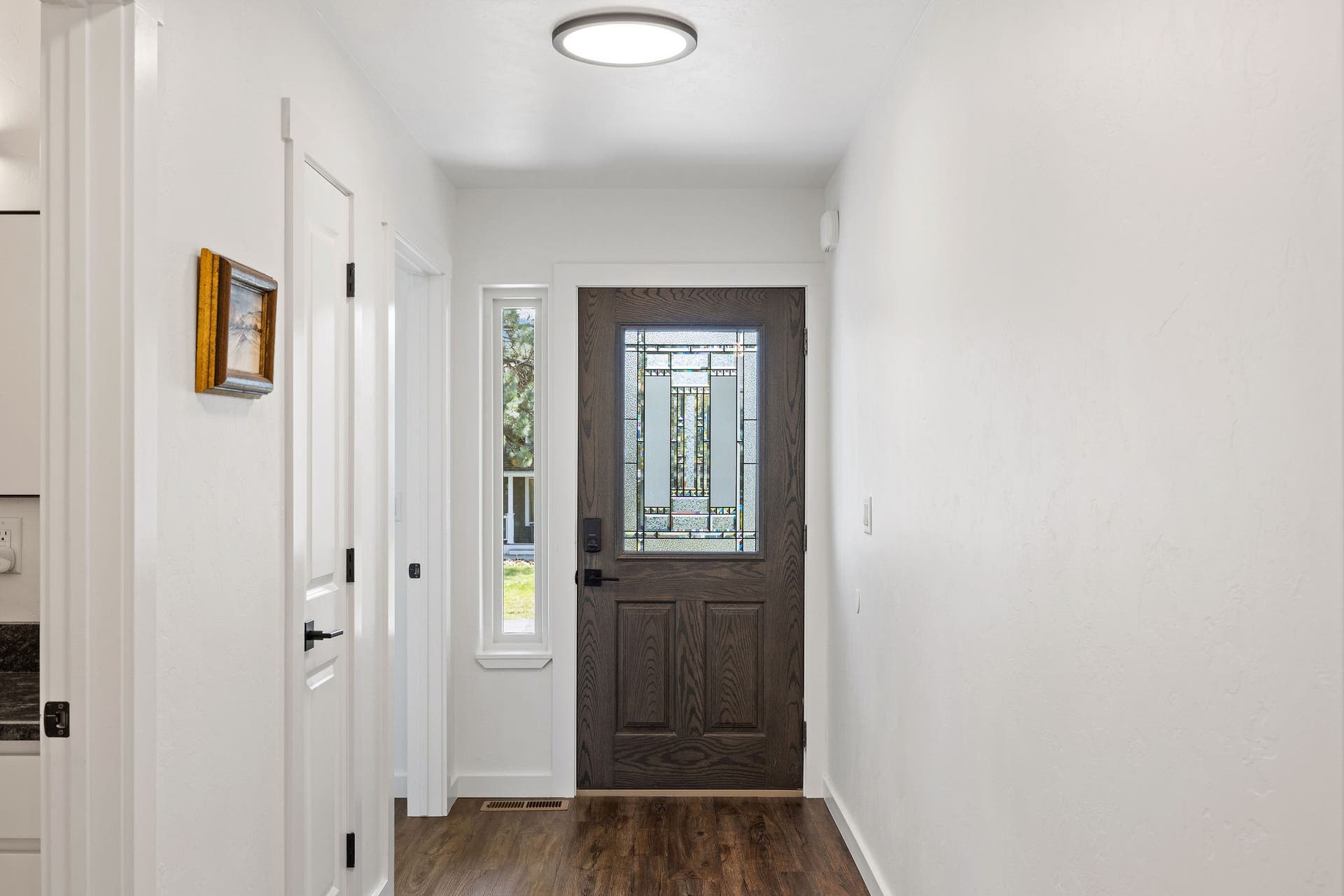 221 Stage Ridge Road, Bigfork, MT 59911 Front door with decorative frosted glass and side window