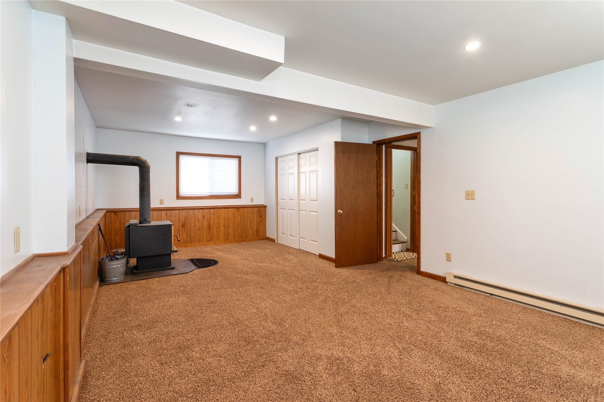 130 Alpine Drive, Bigfork, MT 59911 Downstairs bonus space with cozy wood stove