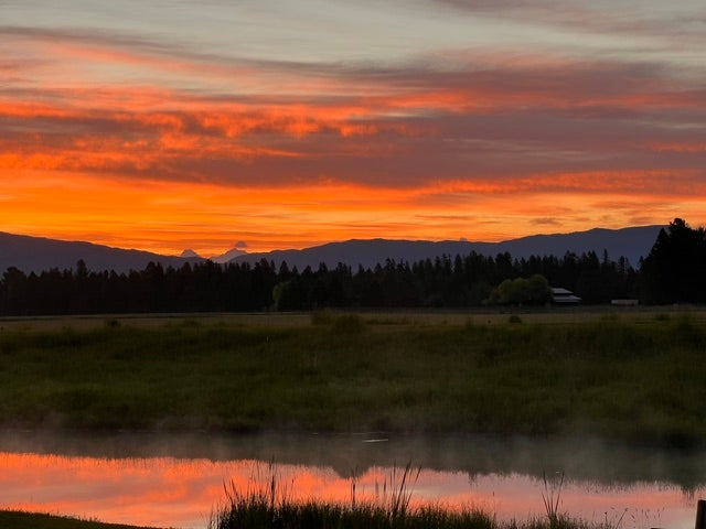 5017 Flatwater Drive, Whitefish, MT 59937 Stunning sunrise views over the surrounding mountains, offering a breathtaking backdrop to start the day and a beautiful reminder of the natural beauty that surrounds 5017 Flatwater Drive in Whitefish, Montana.
