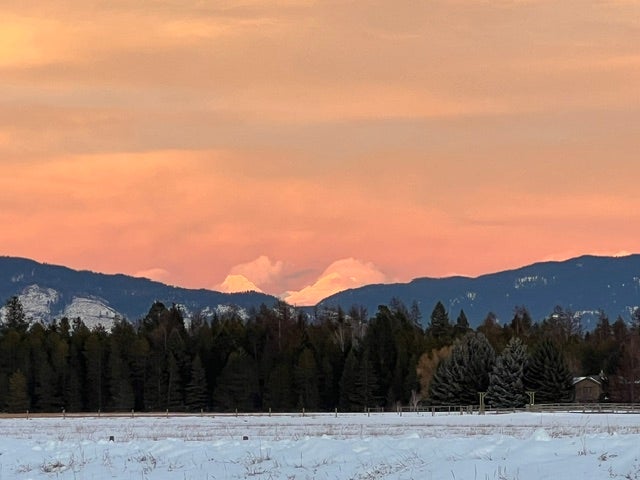 5017 Flatwater Drive, Whitefish, MT 59937 Breathtaking Montana sunrises and mountain views, where the changing light across the surrounding peaks creates a beautiful and ever-changing backdrop! (winter season featured)