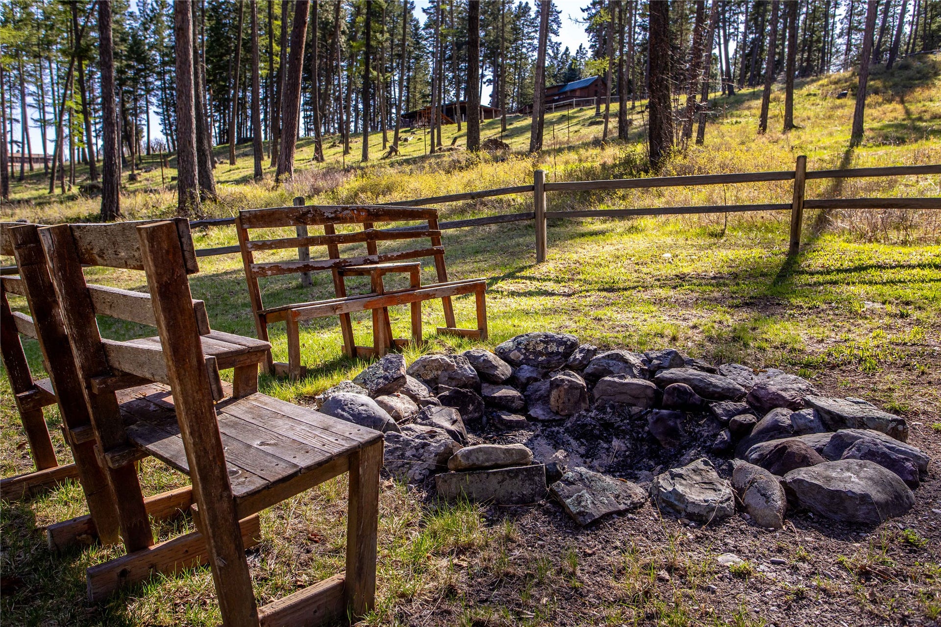 13518 Sylvan Drive, Bigfork, MT 59911 Fire pit outside Eagles Nest Cabin