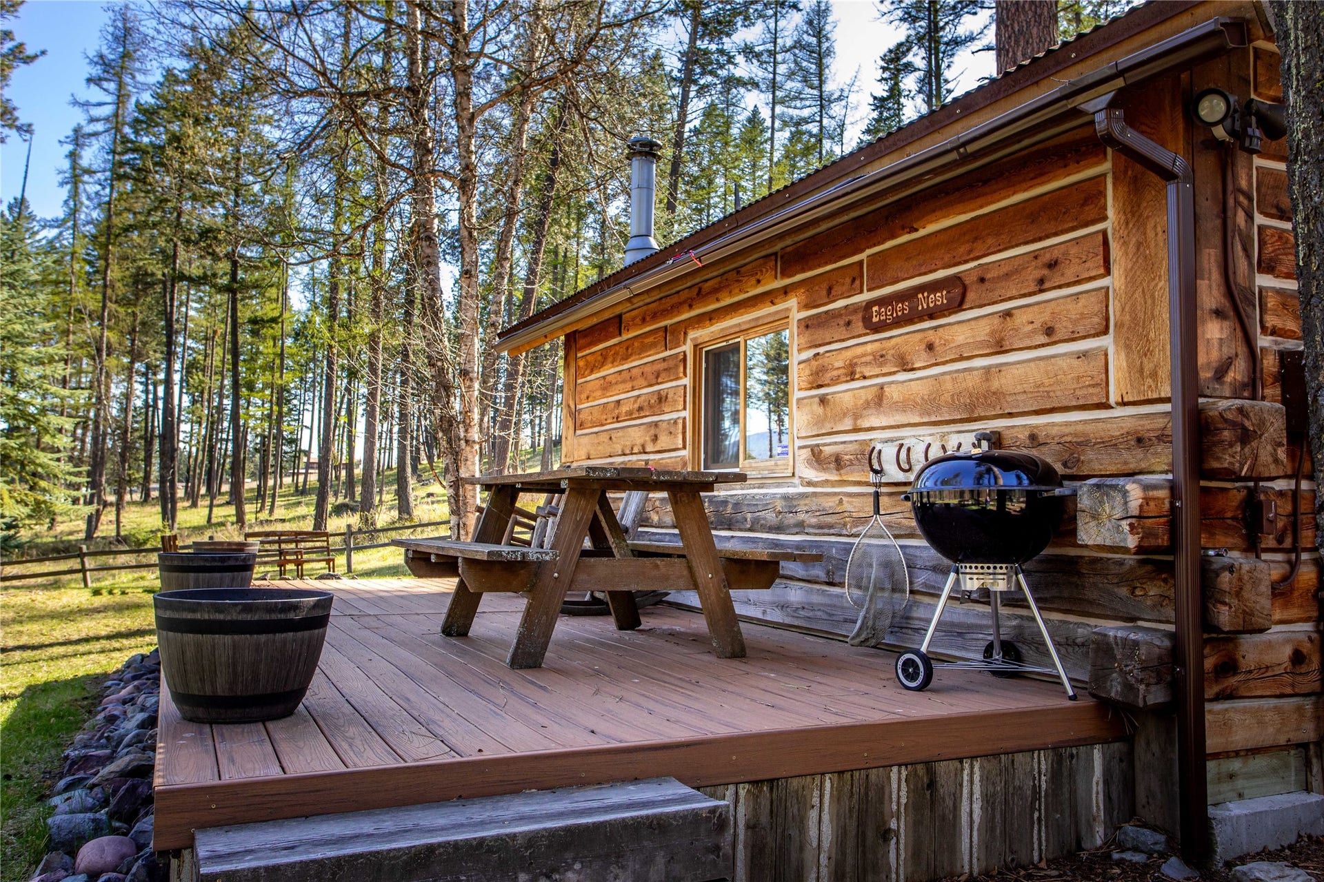 13518 Sylvan Drive, Bigfork, MT 59911 Eagles Nest Cabin deck overlooking pond