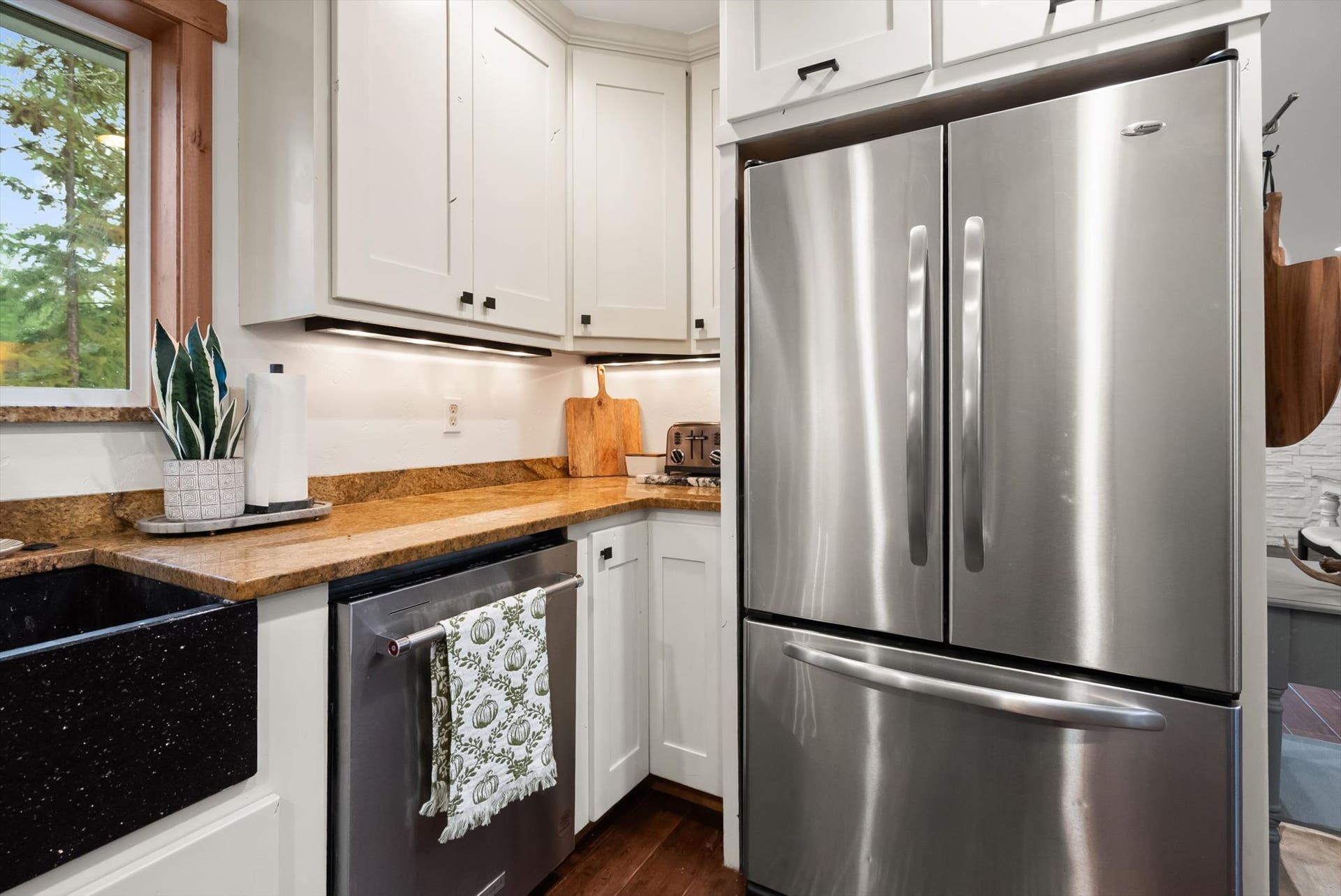 Chef-inspired kitchen featuring custom cabinets, solid granite countertops, and stainless steel appliances.