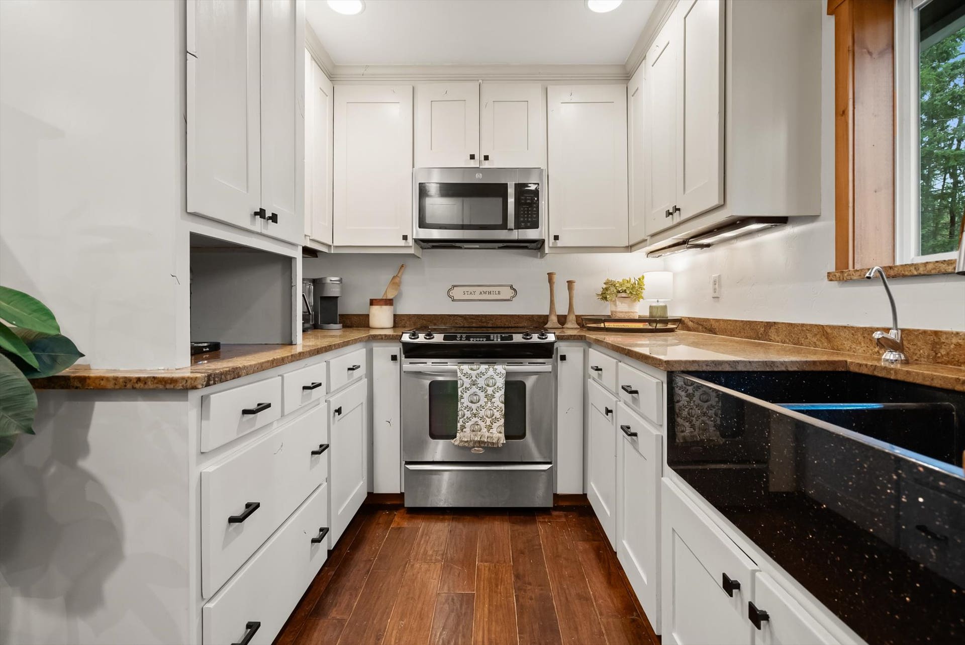 Chef-inspired kitchen featuring custom cabinets, solid granite countertops, and stainless steel appliances.