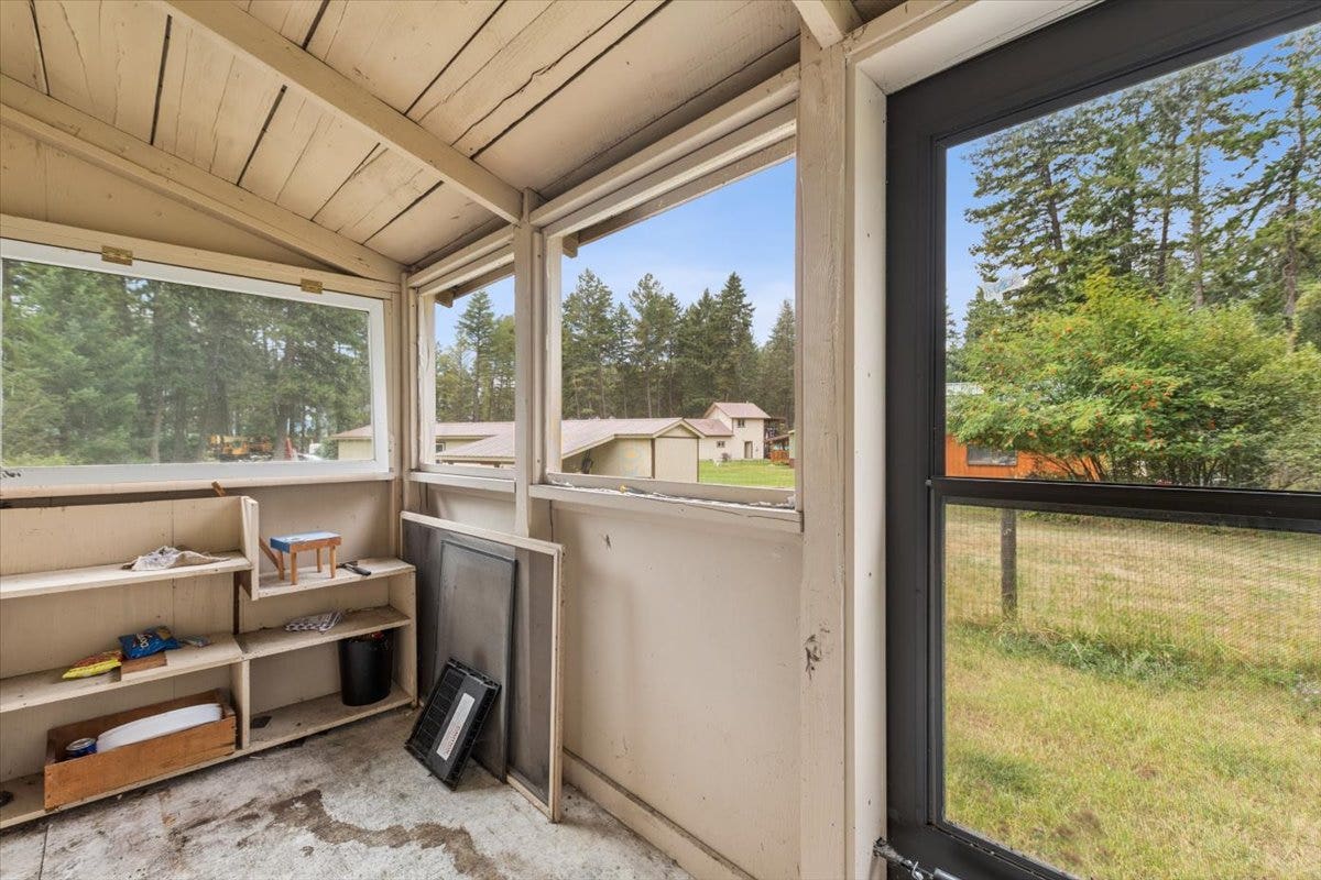 59 Ranchetts Lane, Bigfork, MT 59911 Covered porch off the primary bedroom