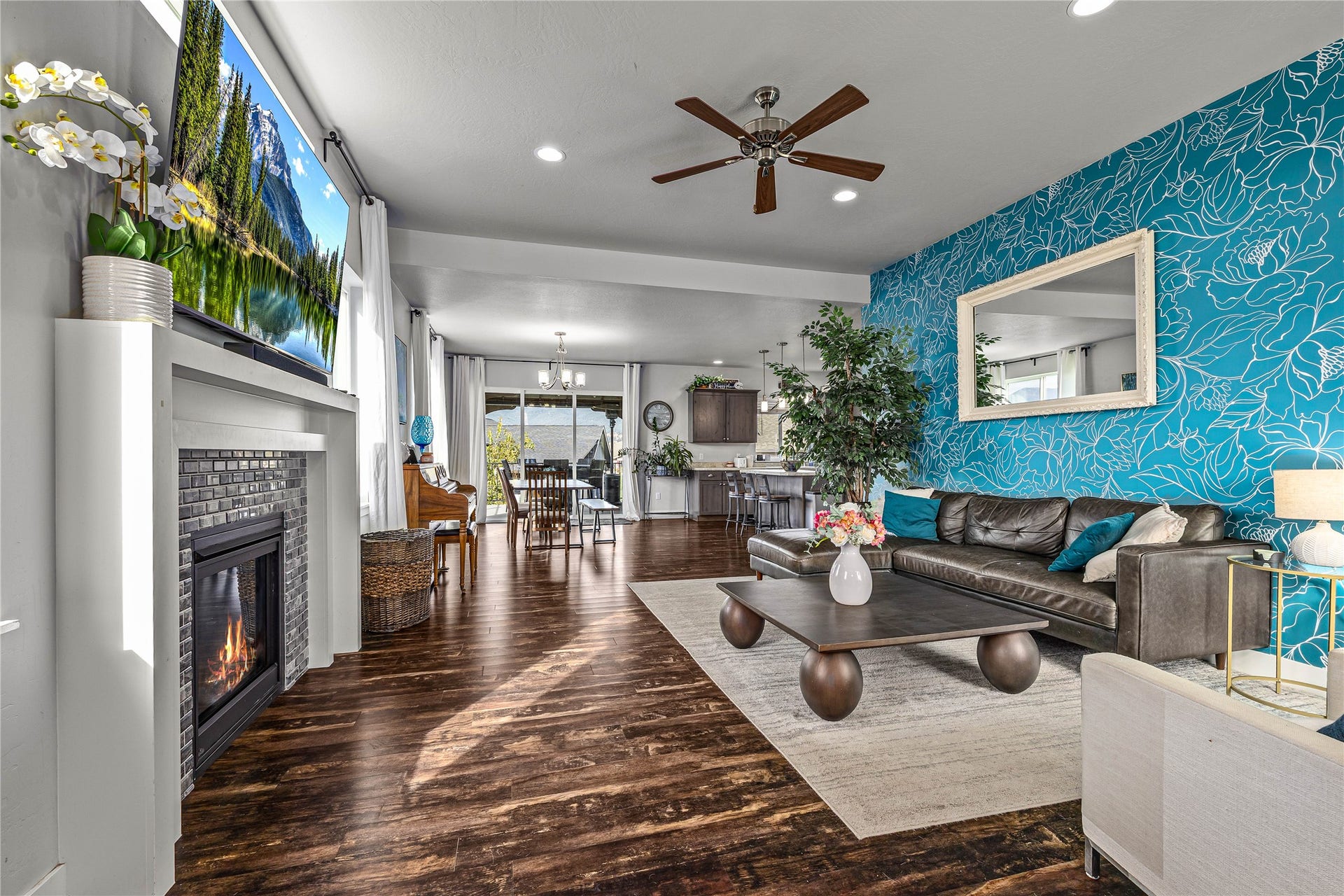 Wood-finish flooring, recessed lighting, and a ceiling fan