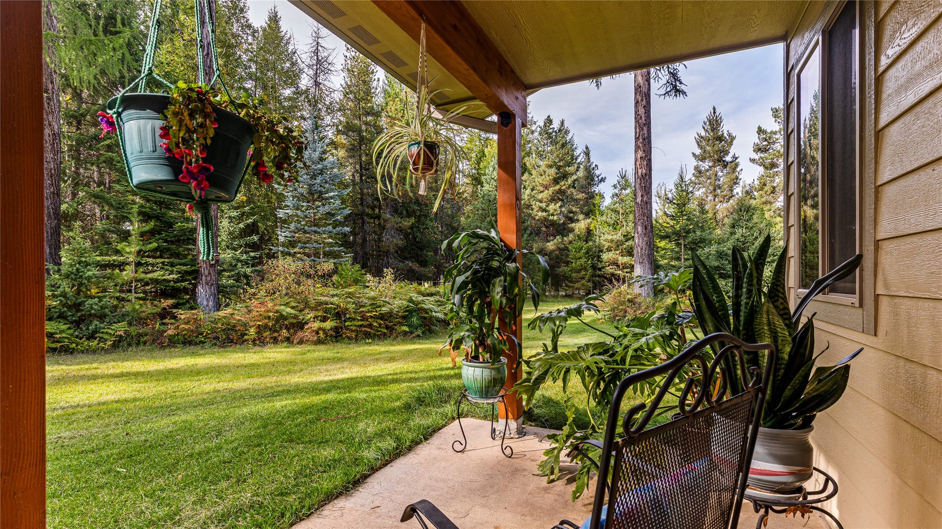 582 Ferndale Drive, Bigfork, MT 59911 Wooded side yard and patio