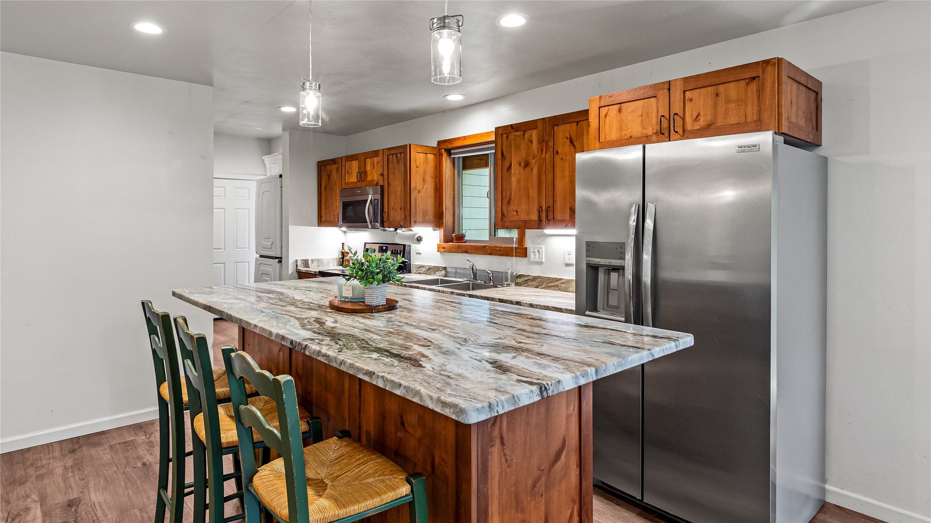 582 Ferndale Drive, Bigfork, MT 59911 Kitchen with granite island and stainless steel appliances.