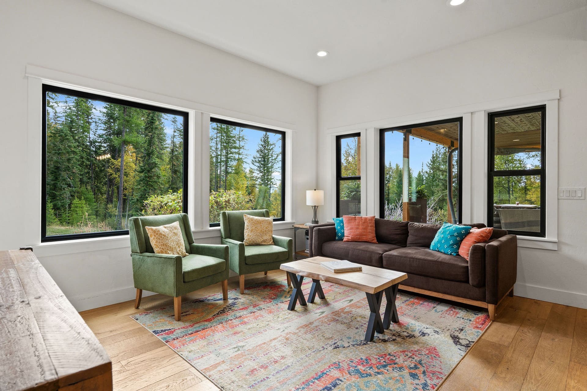 687 N Valley Drive, Whitefish, MT 59937 Cozy and bright den space next to kitchen. Amazing morning light for reading with a cup of coffee. Brand new windows!