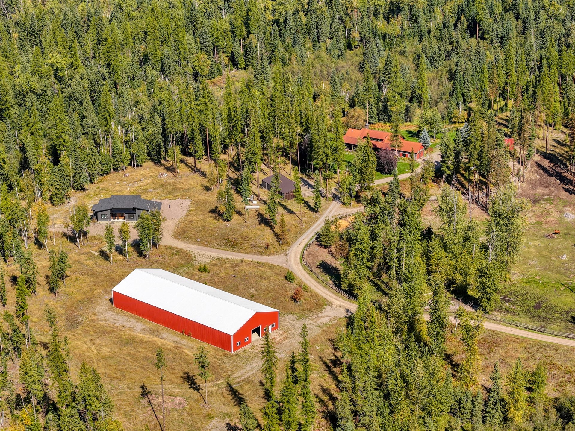 622 Wild Swan Trail, Bigfork, MT 59911 Thoughtfully positioned buildings offer privacy and separation throughout the property