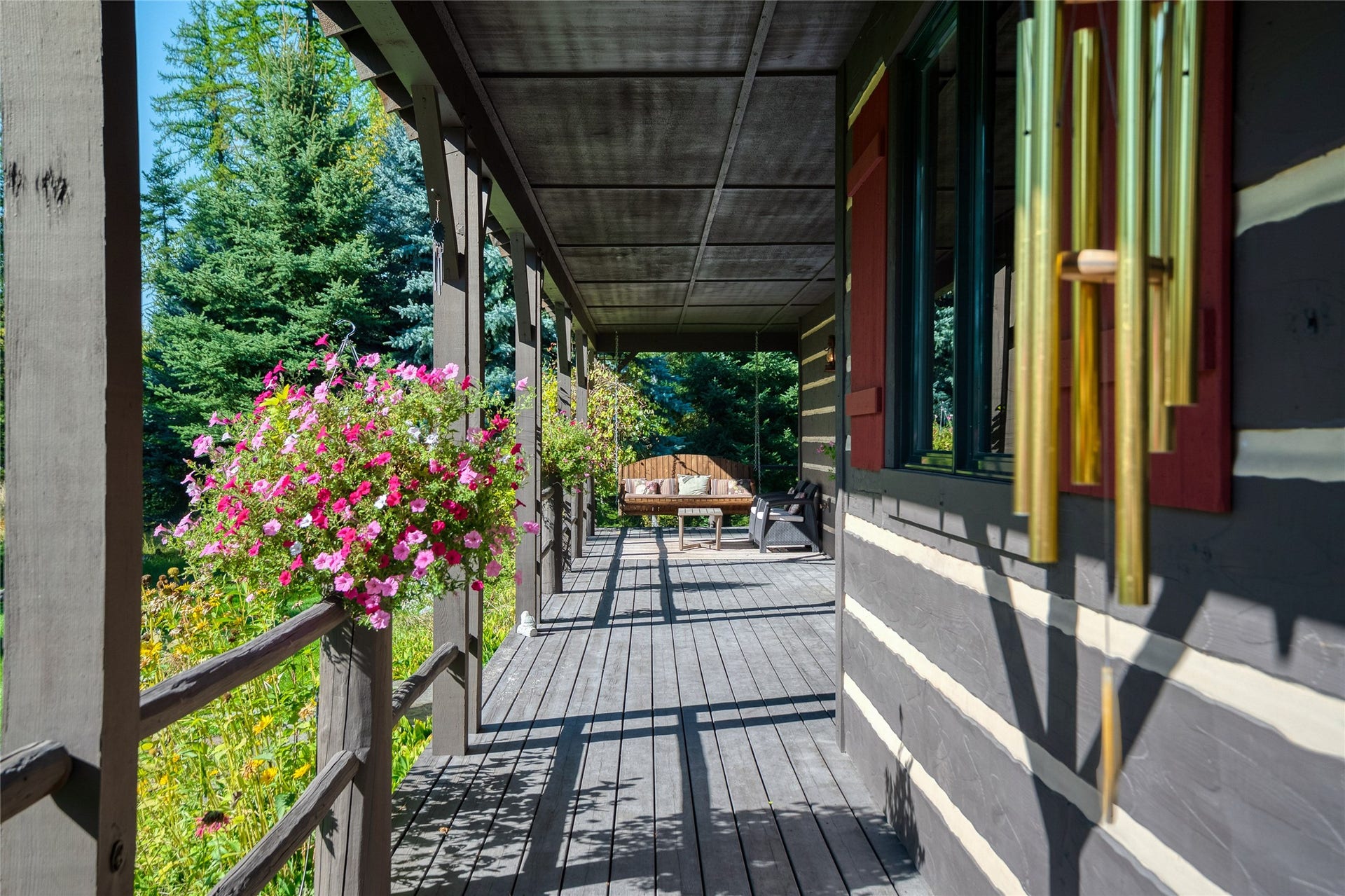 622 Wild Swan Trail, Bigfork, MT 59911 Wrap around covered porch with swing