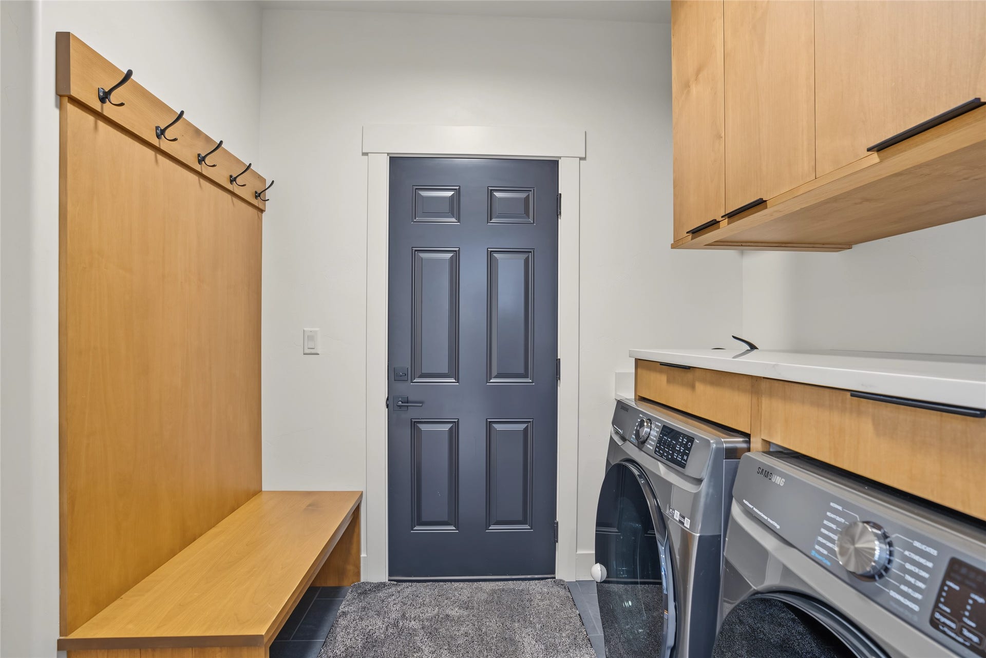 622 Wild Swan Trail, Bigfork, MT 59911 Entry from one car oversized garage to mud/laundry w/built in seating and storage