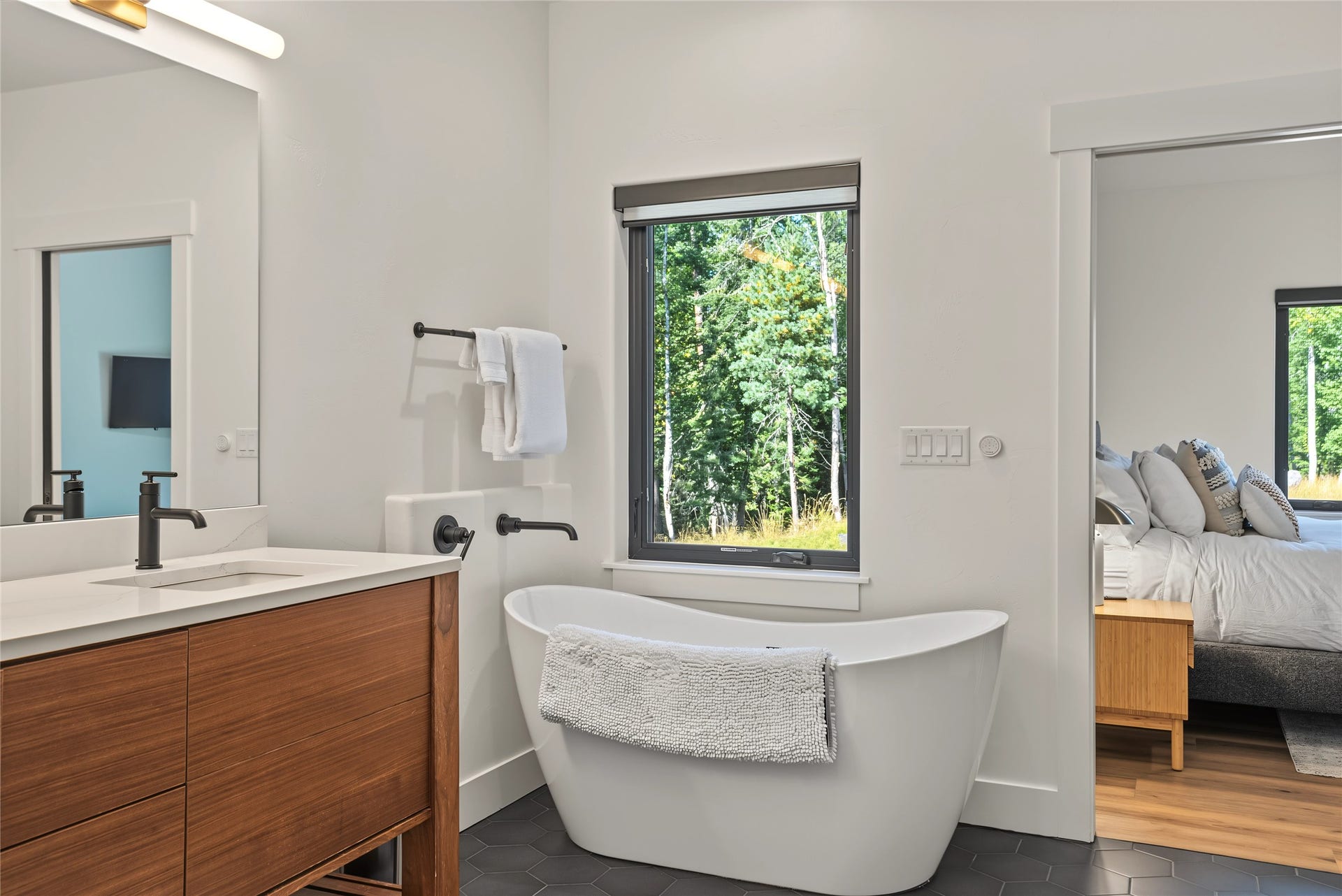 622 Wild Swan Trail, Bigfork, MT 59911 Primary full bath en-suite featuring a freestanding soaking tub and spacious walk-in shower