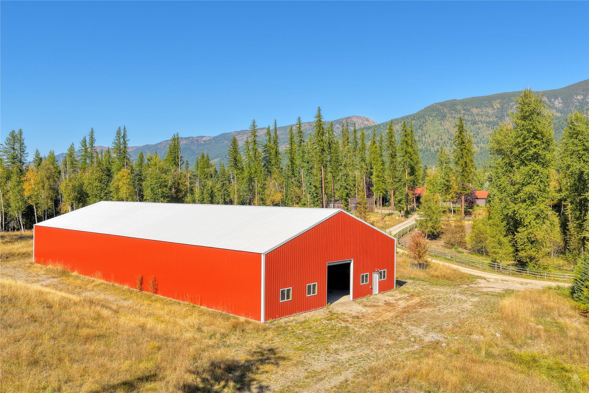 622 Wild Swan Trail, Bigfork, MT 59911 Indoor riding arena main entrance- 2 pedestrian doors and bay door
