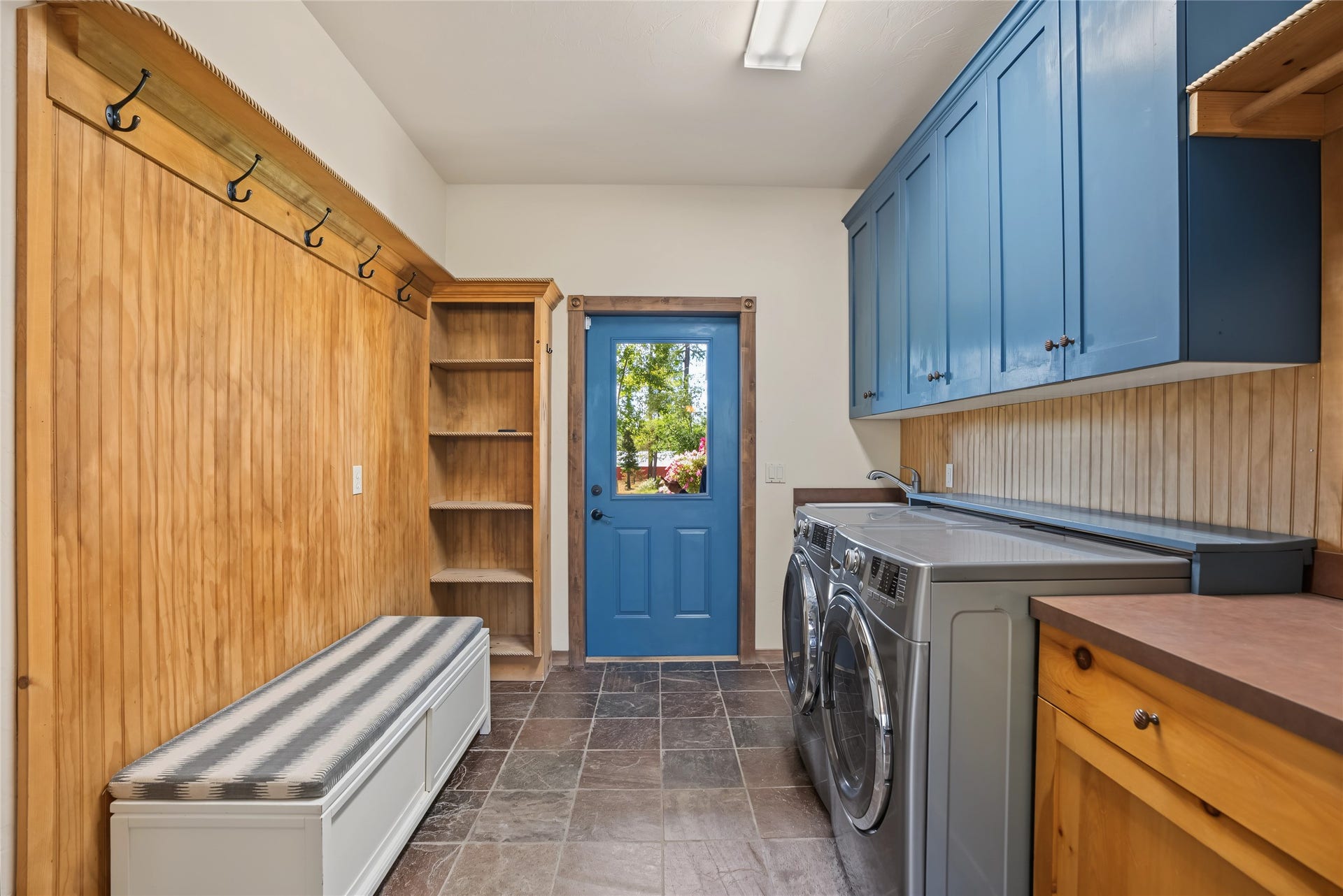 622 Wild Swan Trail, Bigfork, MT 59911 Mud room with sink and built in shelving and entrance from exterior and garage