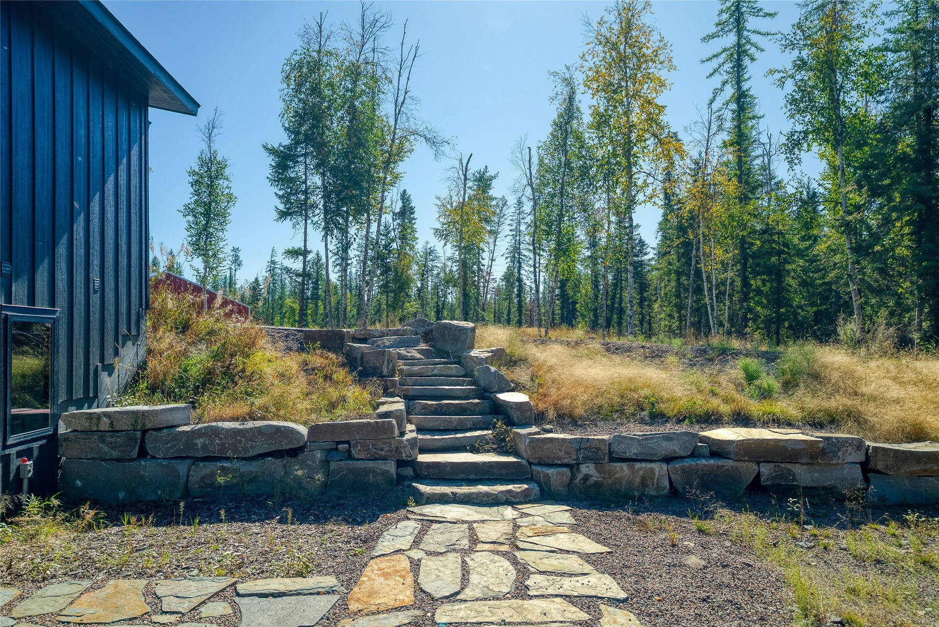 622 Wild Swan Trail, Bigfork, MT 59911 Guest home lower level entrance highlighted by beautiful natural stonework
