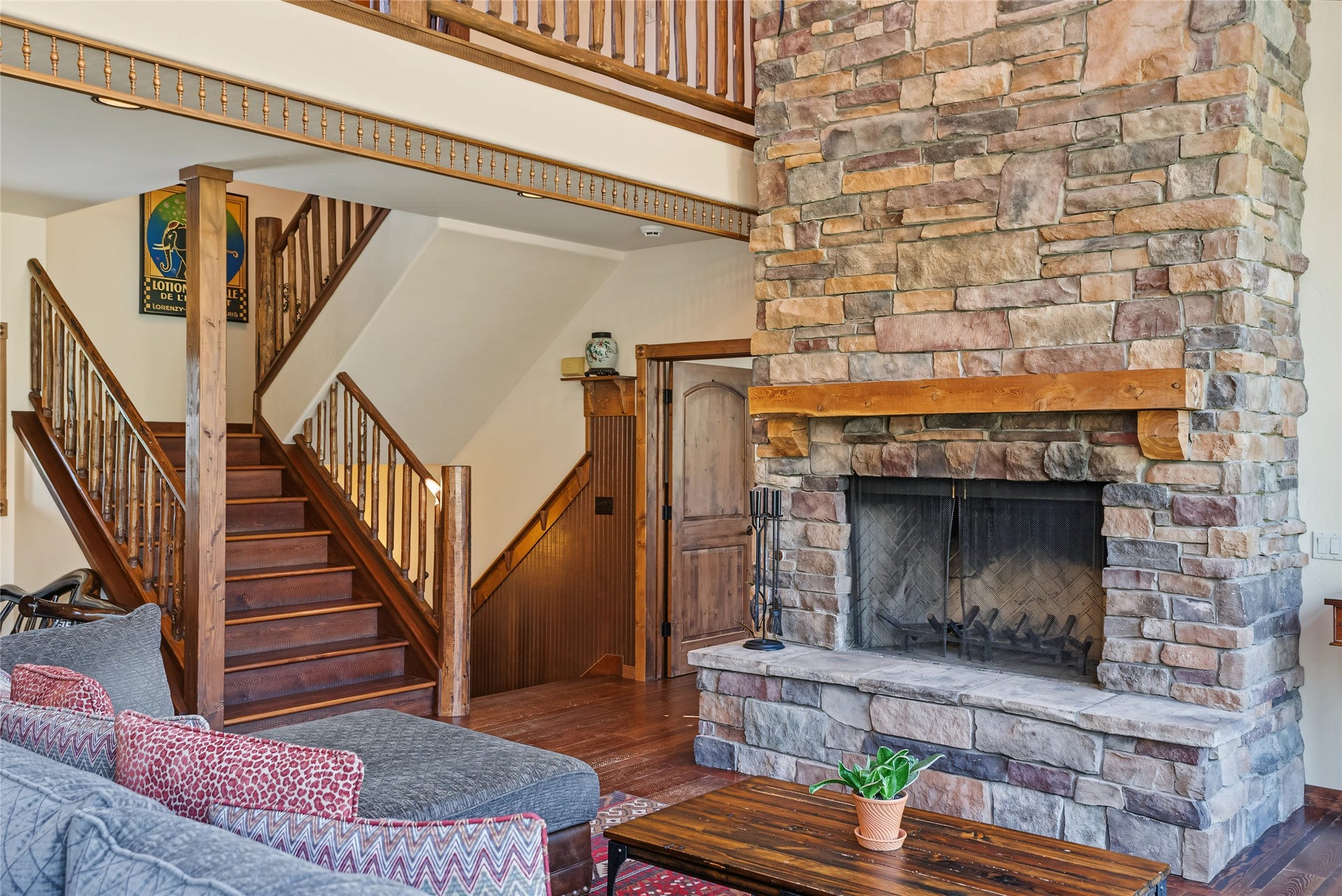 622 Wild Swan Trail, Bigfork, MT 59911 Great room showcasing the home's open layout, with/access to the primary suite, upper loft, and lower-level living space