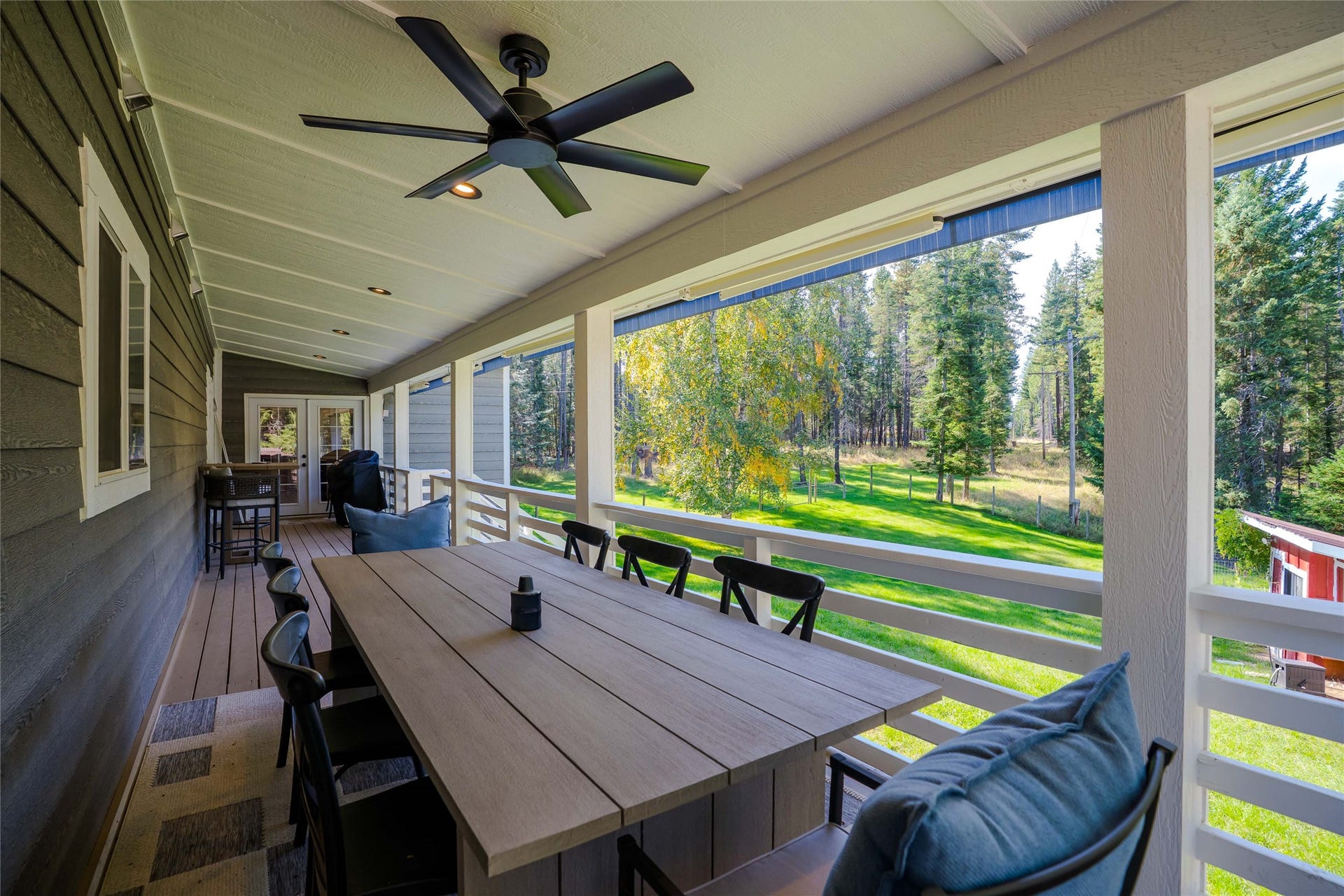 4926 Foothill Road, Bigfork, MT 59911 Southside porch off door to kitchen with outdoor dining area
