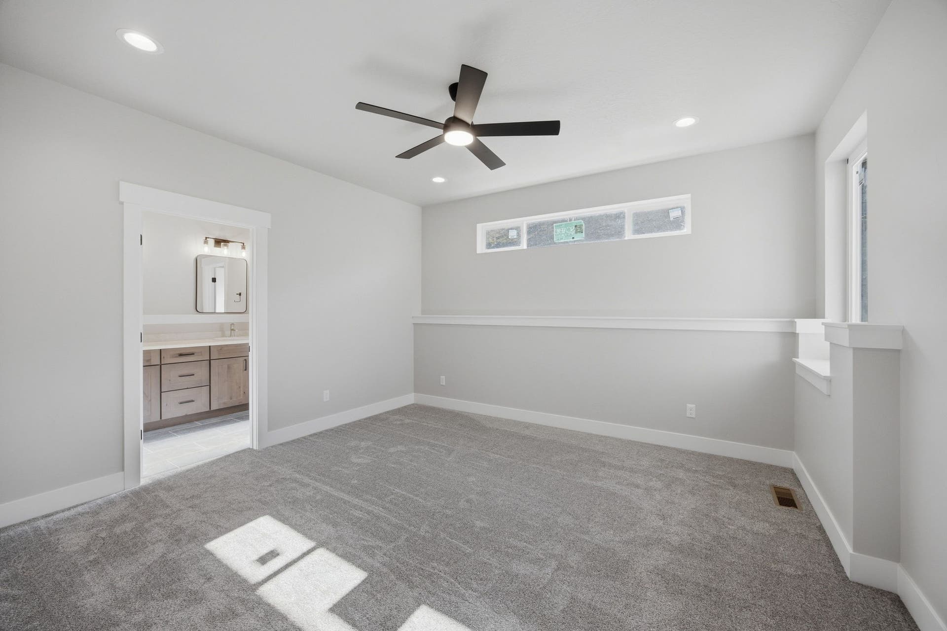 Wall-to-wall carpeting and recessed lighting