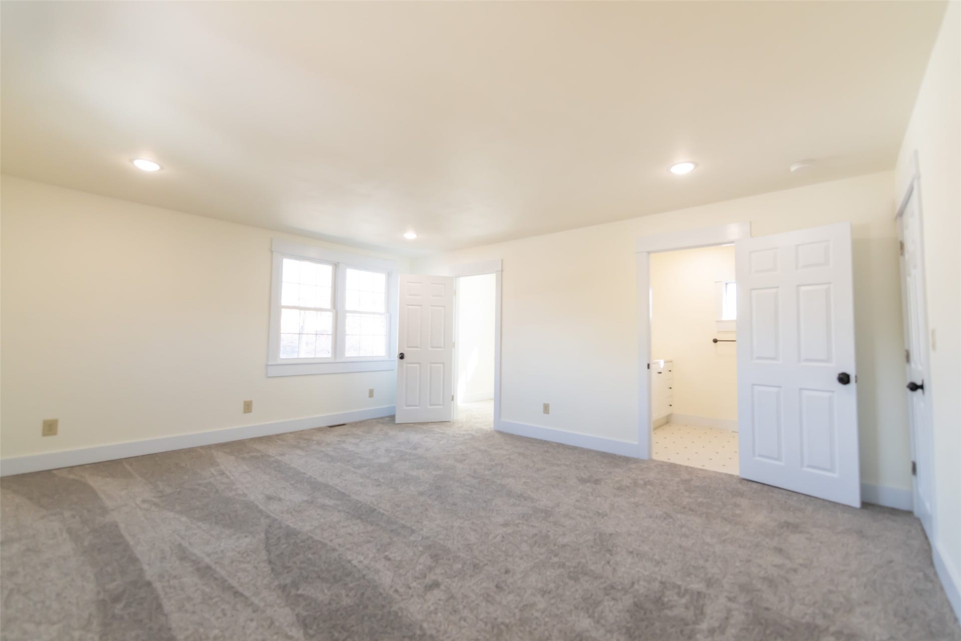 705 W Park Street, Butte, MT 59701 Recessed lighting, light-colored walls, carpeted flooring, white trim, and a white six-panel door