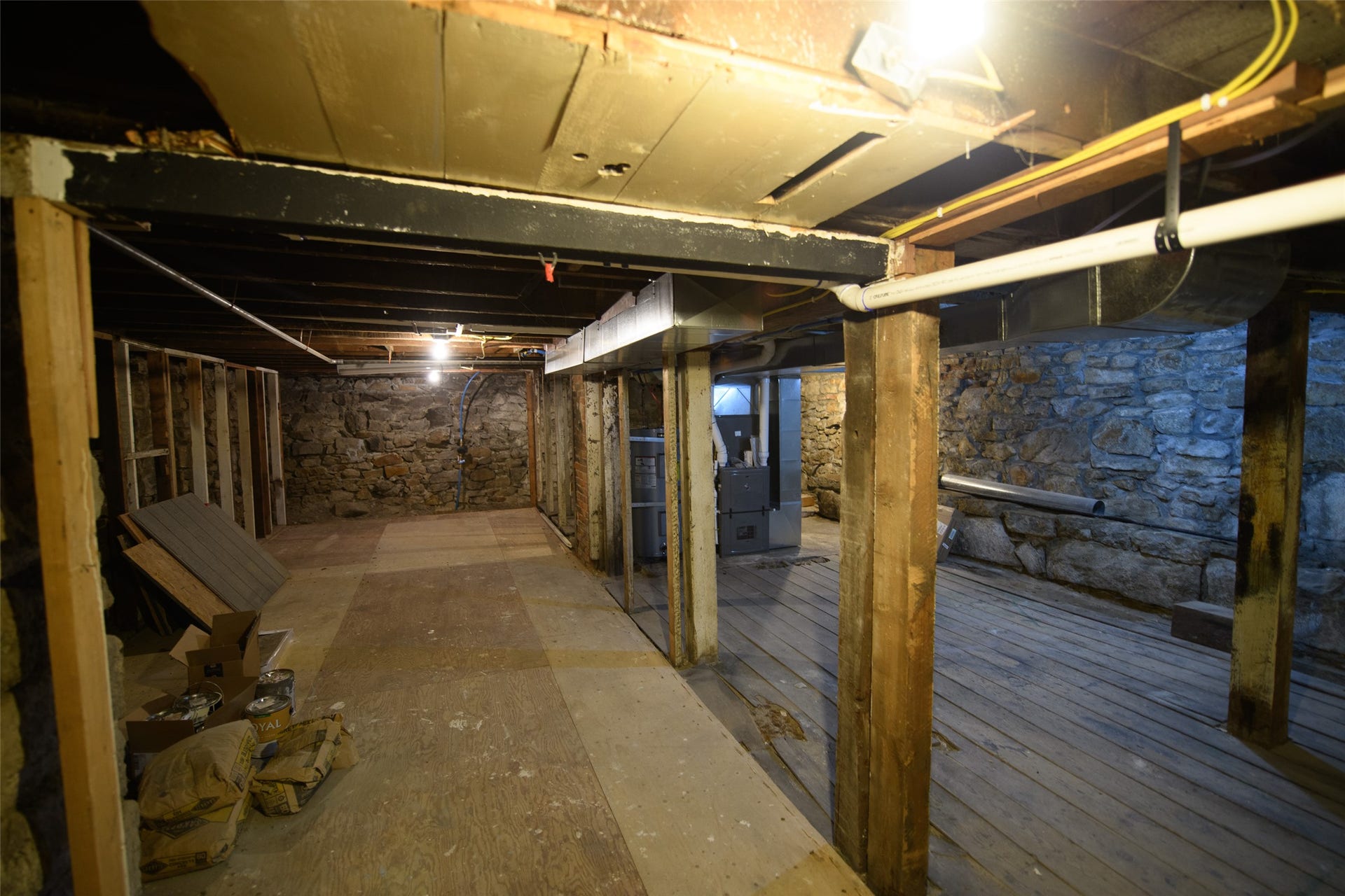 705 W Park Street, Butte, MT 59701 Stone foundation walls, exposed wood ceiling joists, wood flooring, structural wood beams, and a utility system