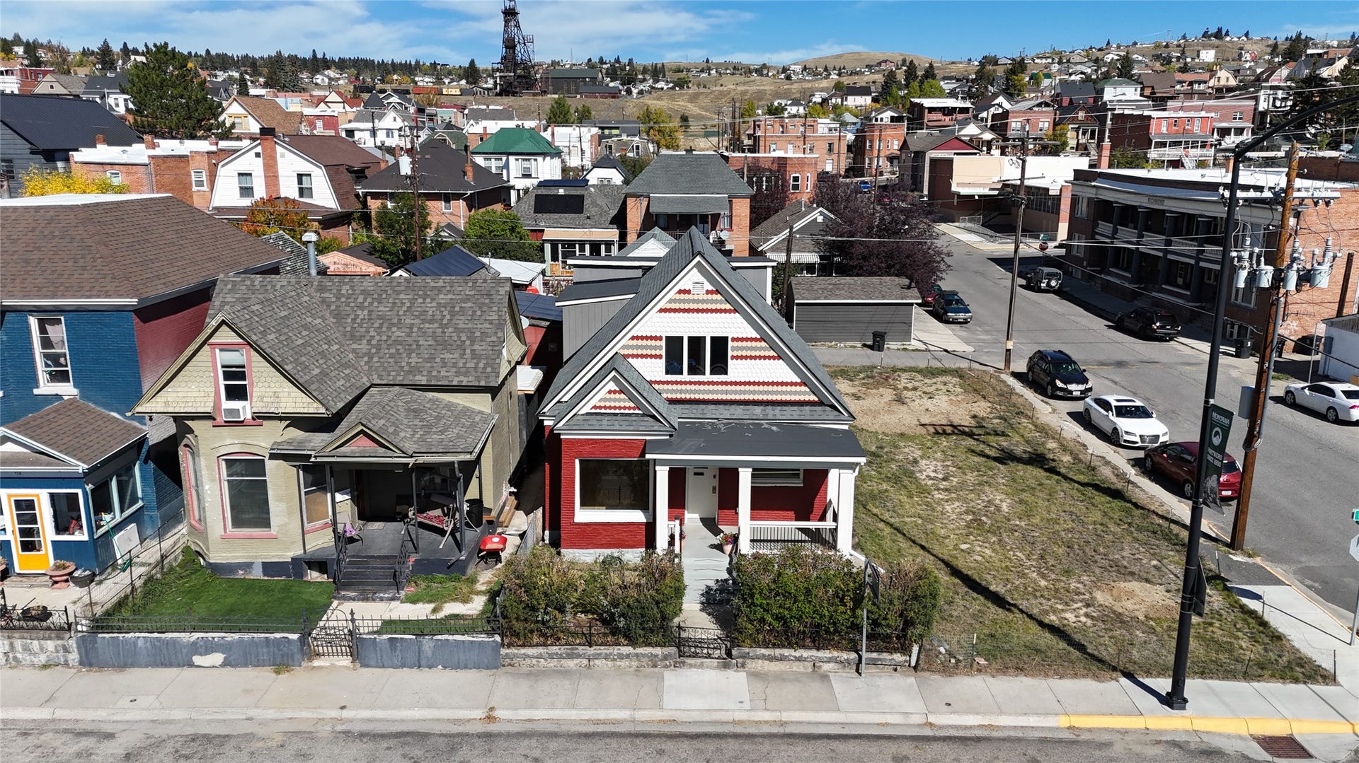 705 W Park Street, Butte, MT 59701 Red facade featuring white trim and a covered front porch