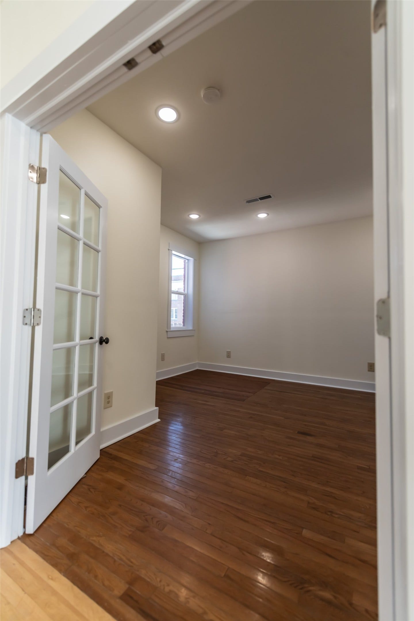 705 W Park Street, Butte, MT 59701 Room featuring wood flooring, recessed lighting, and a window