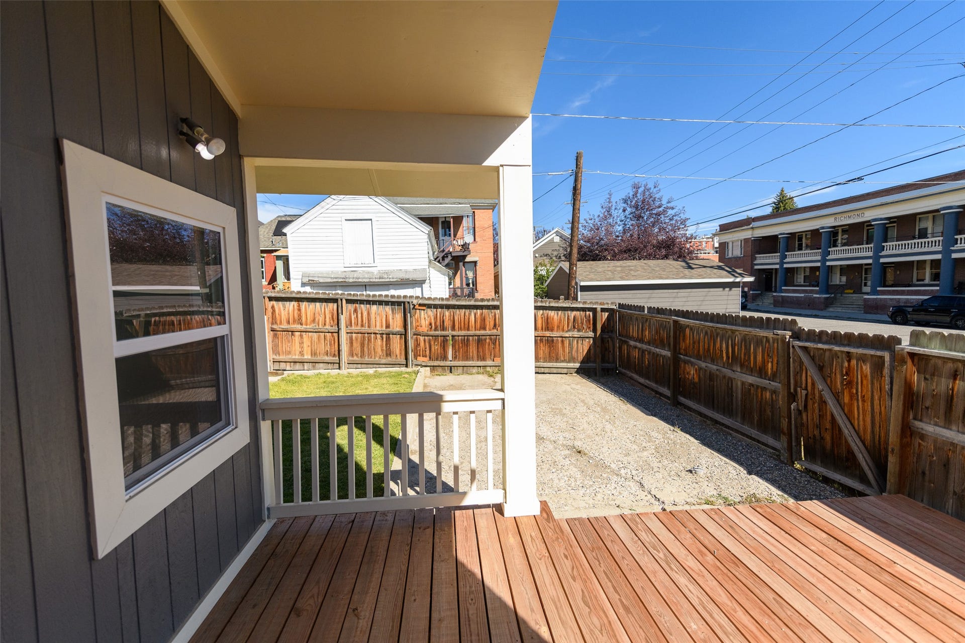 705 W Park Street, Butte, MT 59701 Outdoor deck with wood planking, white railing, and a covered porch area