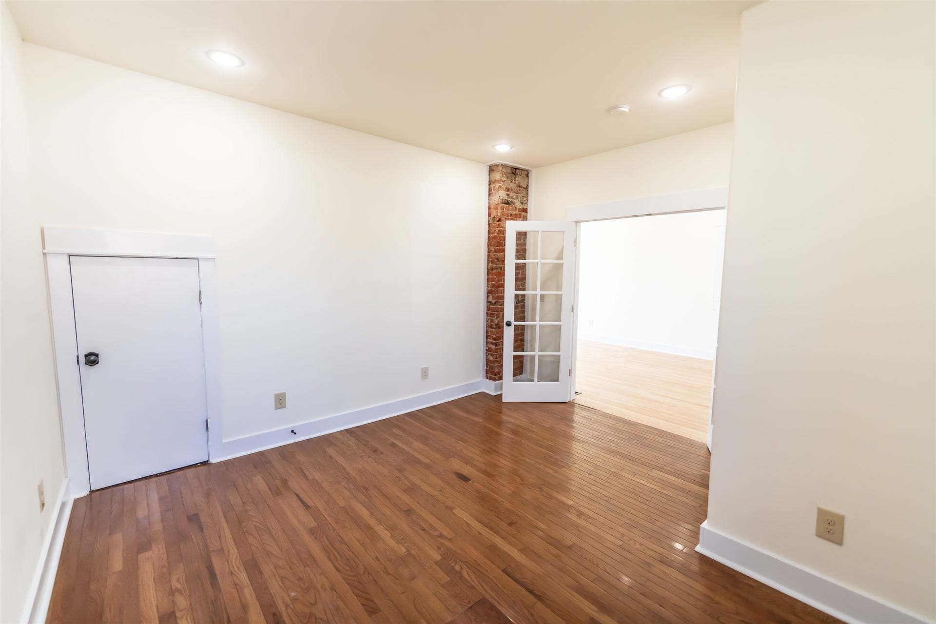 705 W Park Street, Butte, MT 59701 Hardwood flooring throughout, recessed lighting, exposed brick column, and French doors