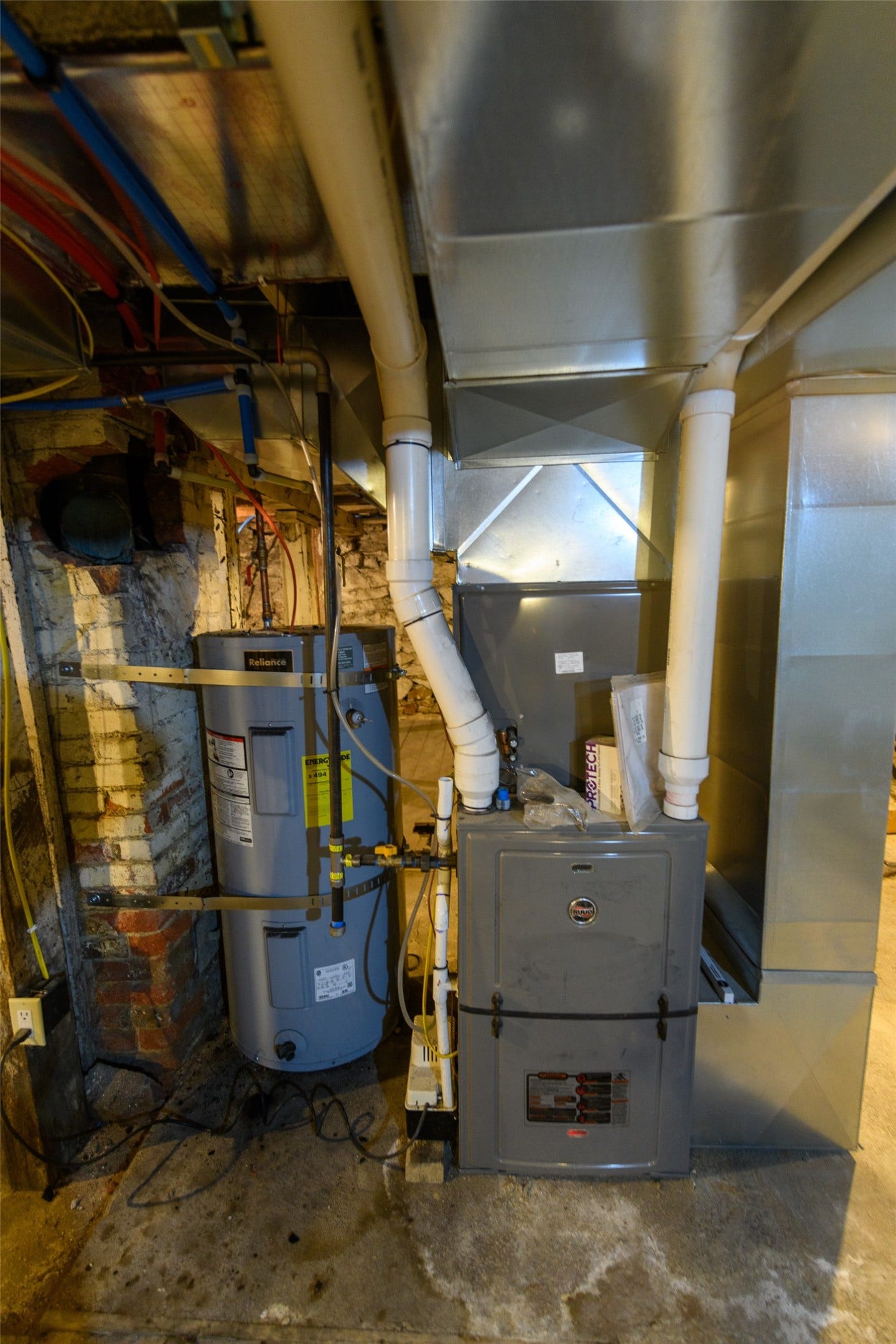 705 W Park Street, Butte, MT 59701 Water heater and furnace with exposed ductwork and plumbing
