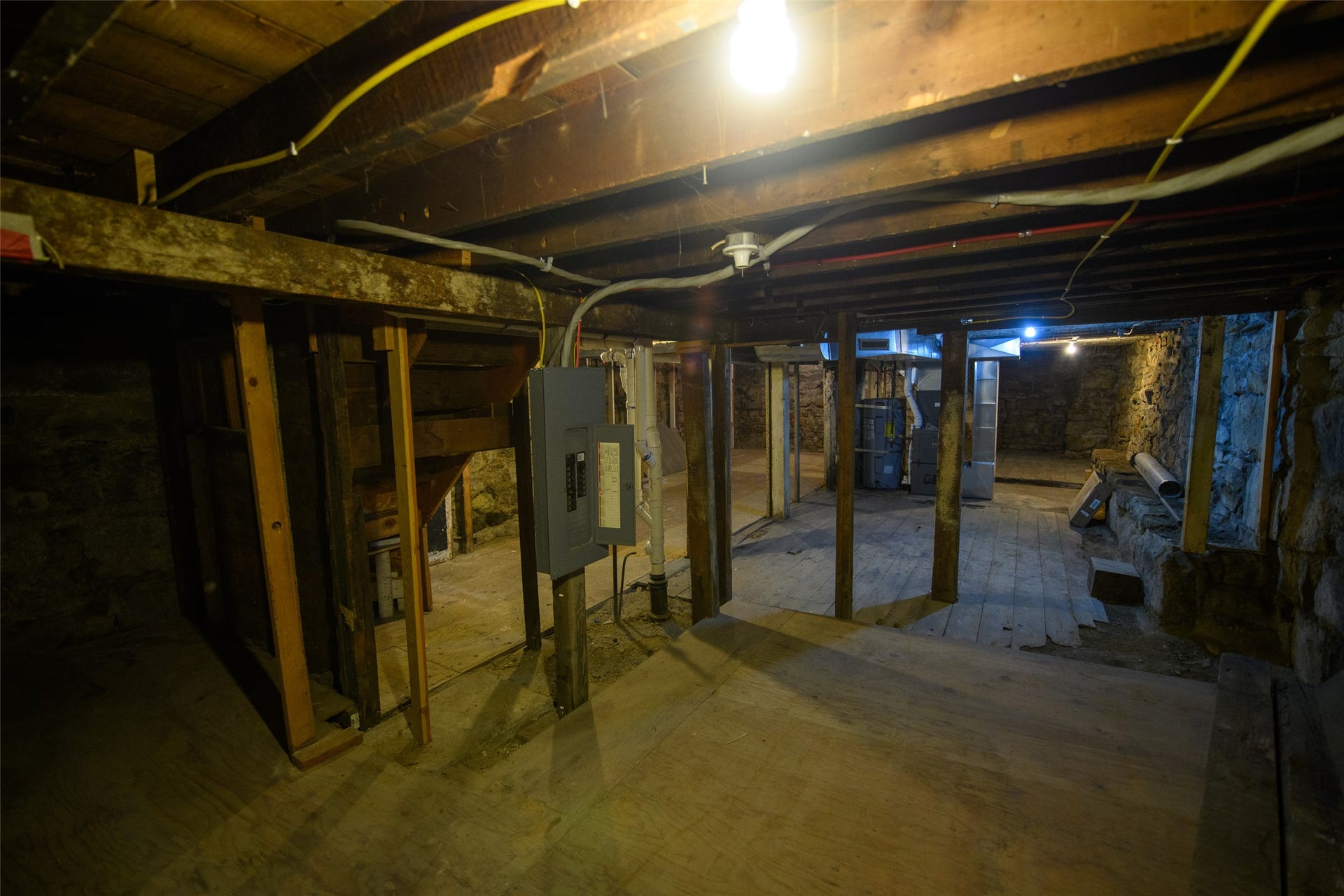 705 W Park Street, Butte, MT 59701 Exposed wooden beam ceiling, stone foundation walls, and an electrical service panel