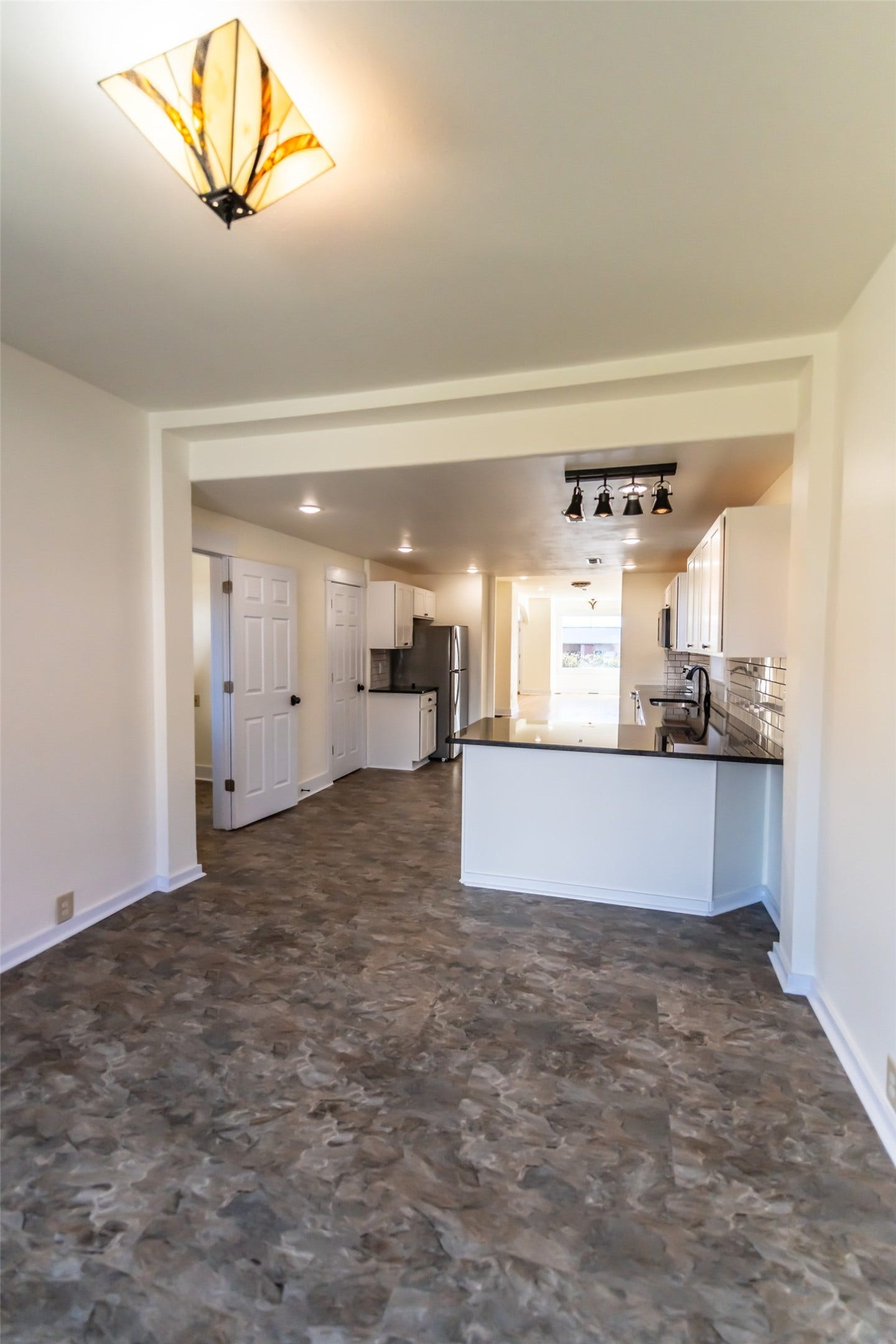 705 W Park Street, Butte, MT 59701 Open concept design with patterned flooring, recessed lighting, and a kitchen island with dark countertops