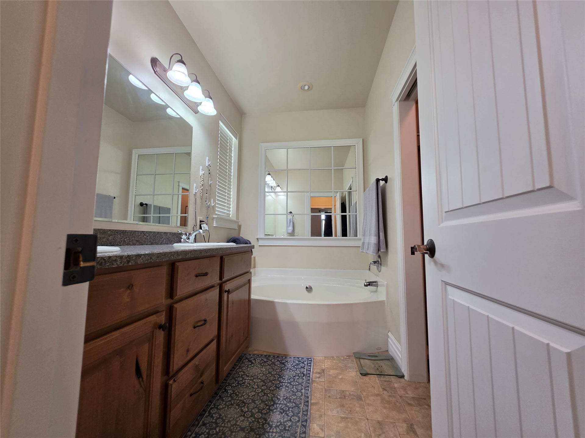 585 Wildflower Circle, Hamilton, MT 59840 Built-in vanity with wood cabinetry and dark stone-finish countertop