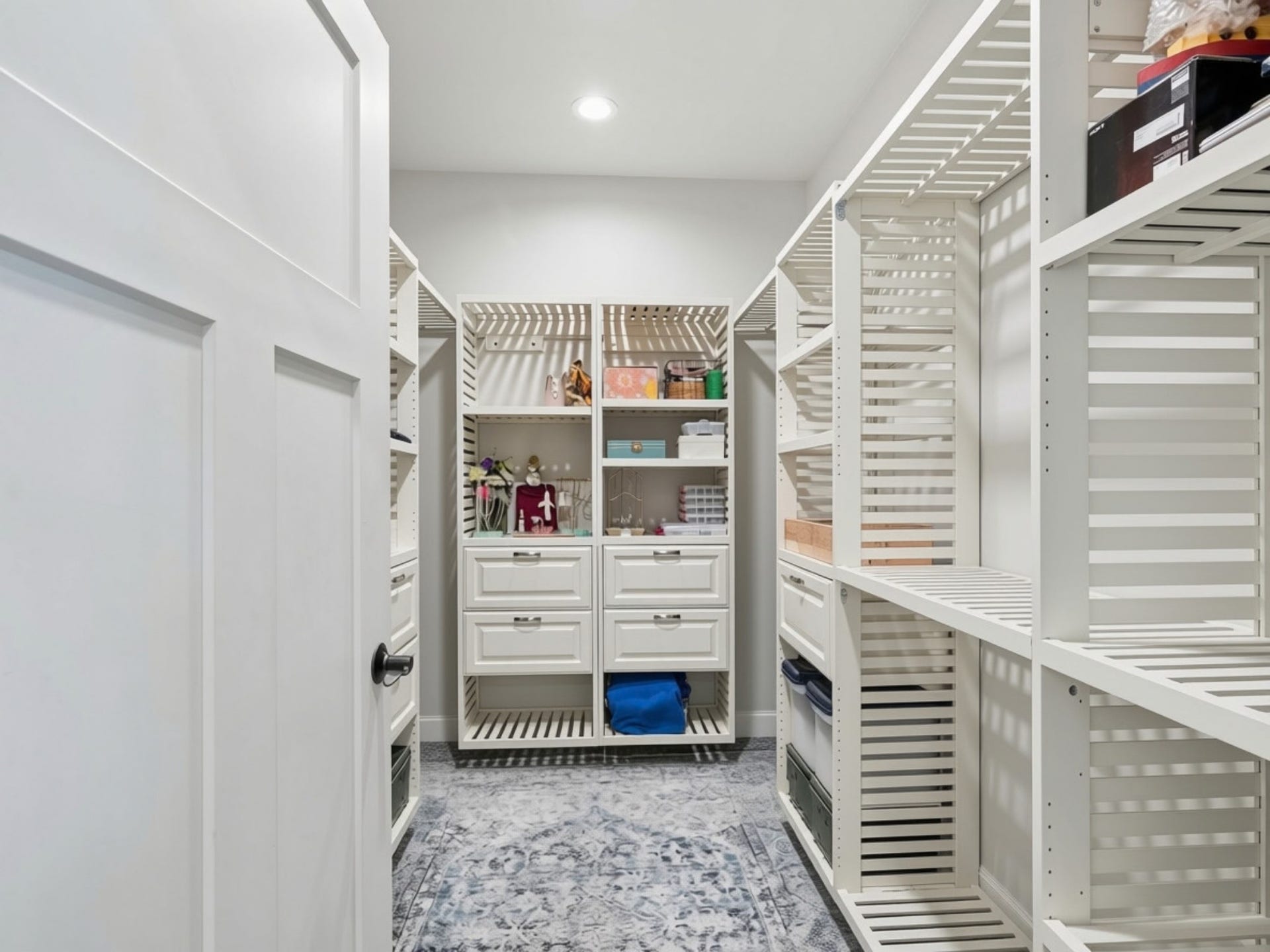 148 Fox Den Trail, Kalispell, MT 59901 Built-in closet system with adjustable shelving, integrated drawers, and recessed lighting