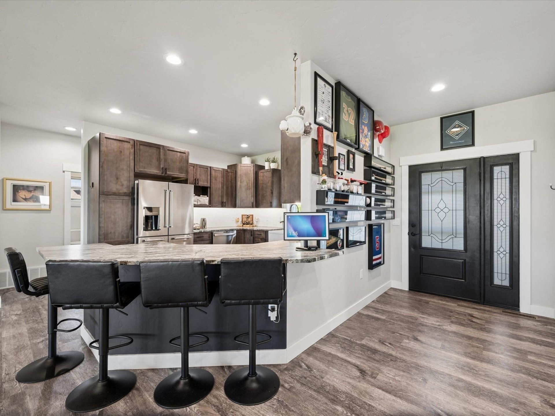148 Fox Den Trail, Kalispell, MT 59901 Kitchen with wood-finish cabinetry, stainless steel refrigerator, and recessed lighting
