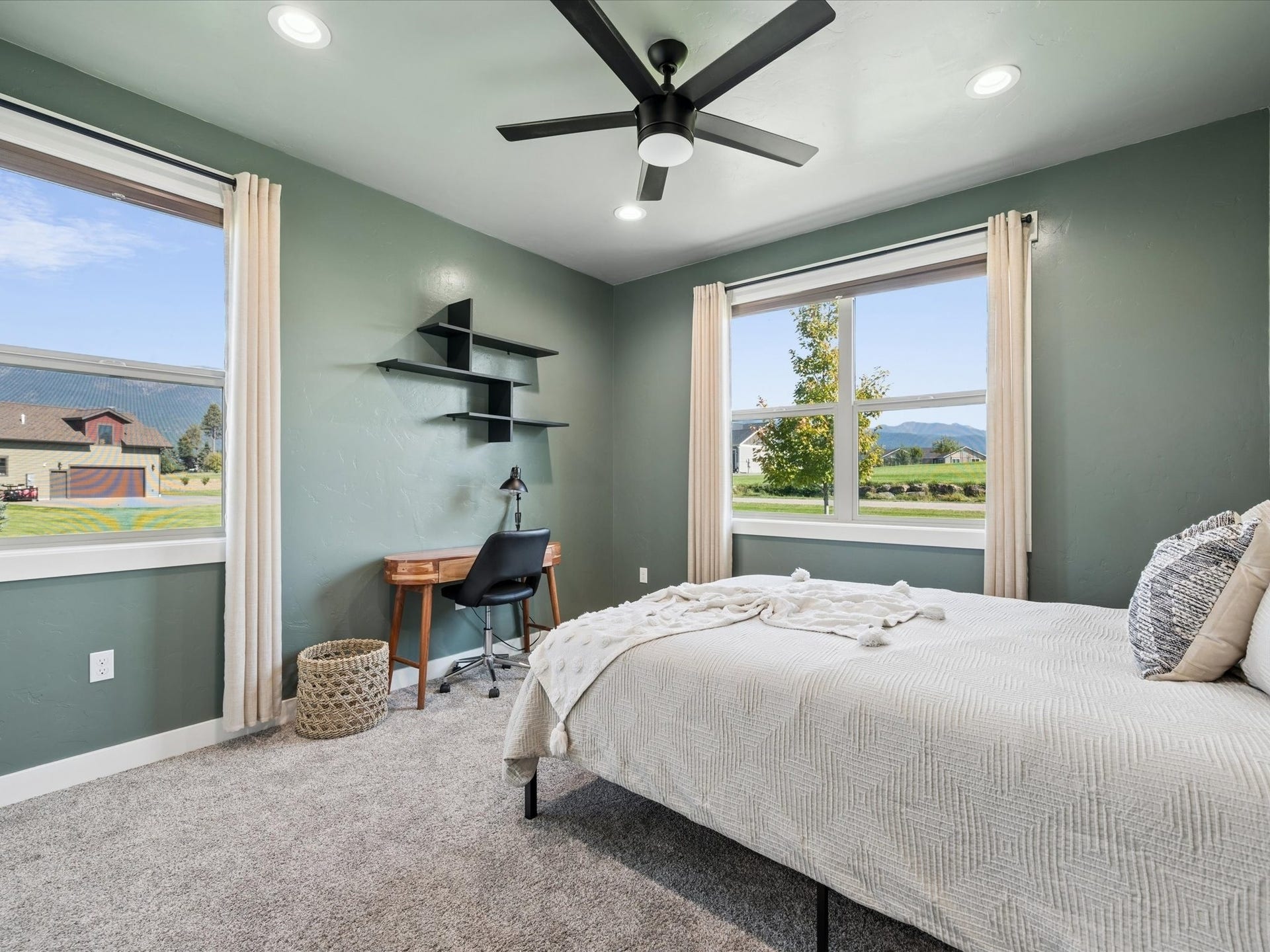 148 Fox Den Trail, Kalispell, MT 59901 Recessed lighting, ceiling fan, two windows, and carpeted flooring