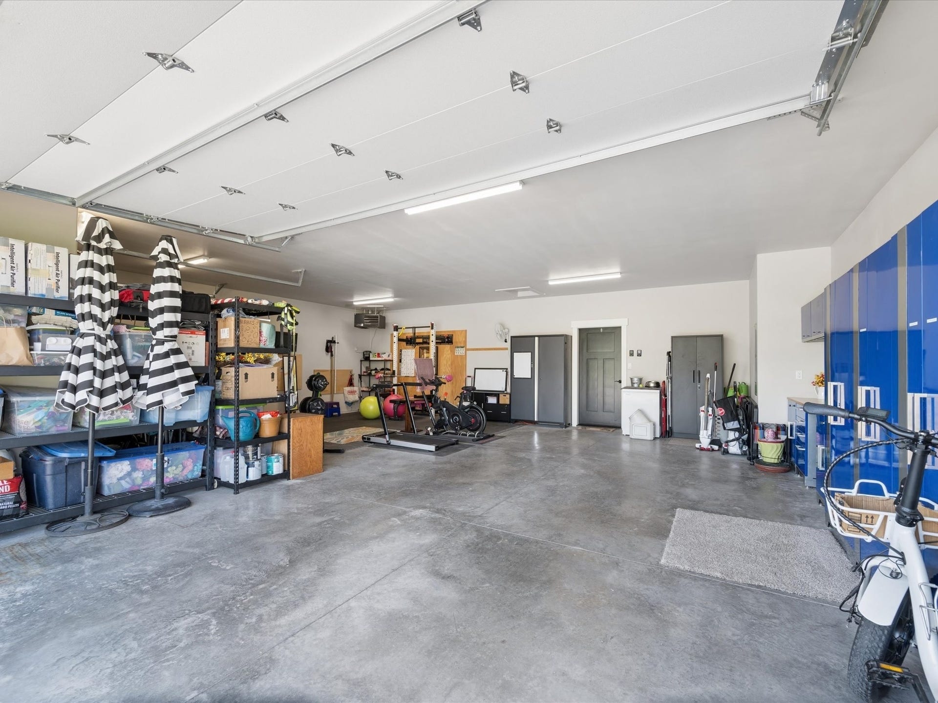148 Fox Den Trail, Kalispell, MT 59901 Spacious 3 car garage with storage cabinets and racks