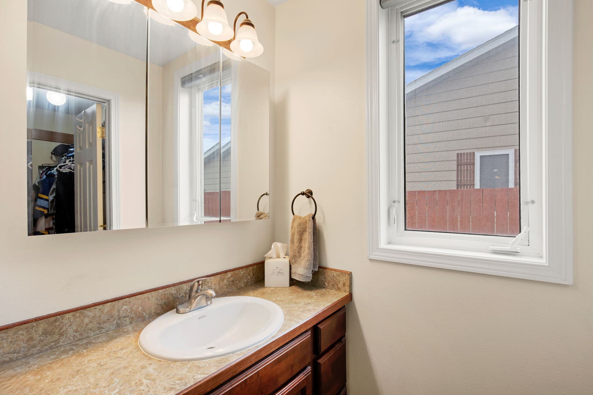 2541 Castle Pines Way, Great Falls, MT 59405 Recessed sink with a chrome faucet, set into a stone-look countertop