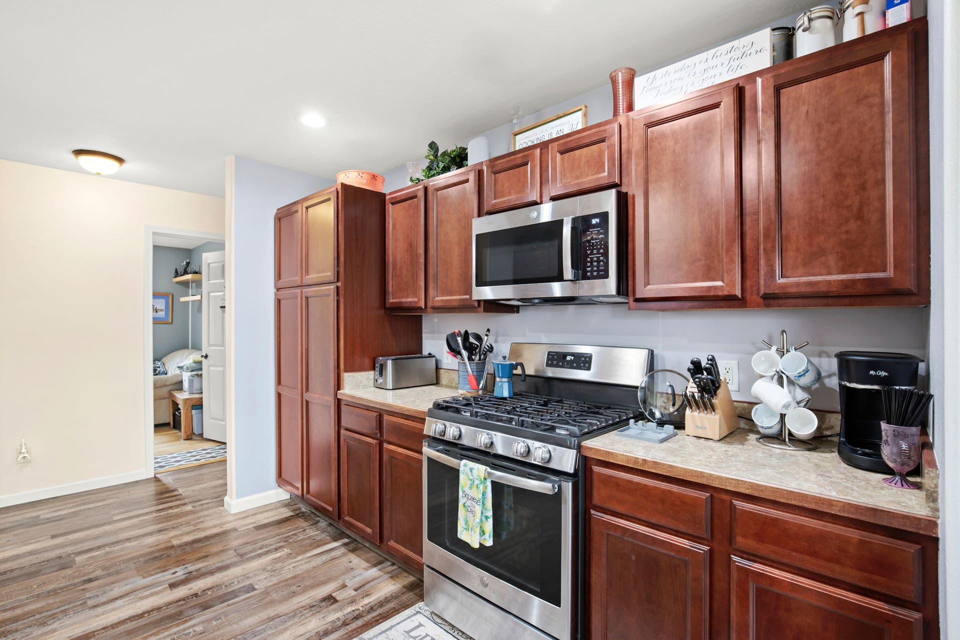 2541 Castle Pines Way, Great Falls, MT 59405 Wood-finish flooring, full-height pantry, stainless steel appliances, wood cabinetry, and laminate countertops